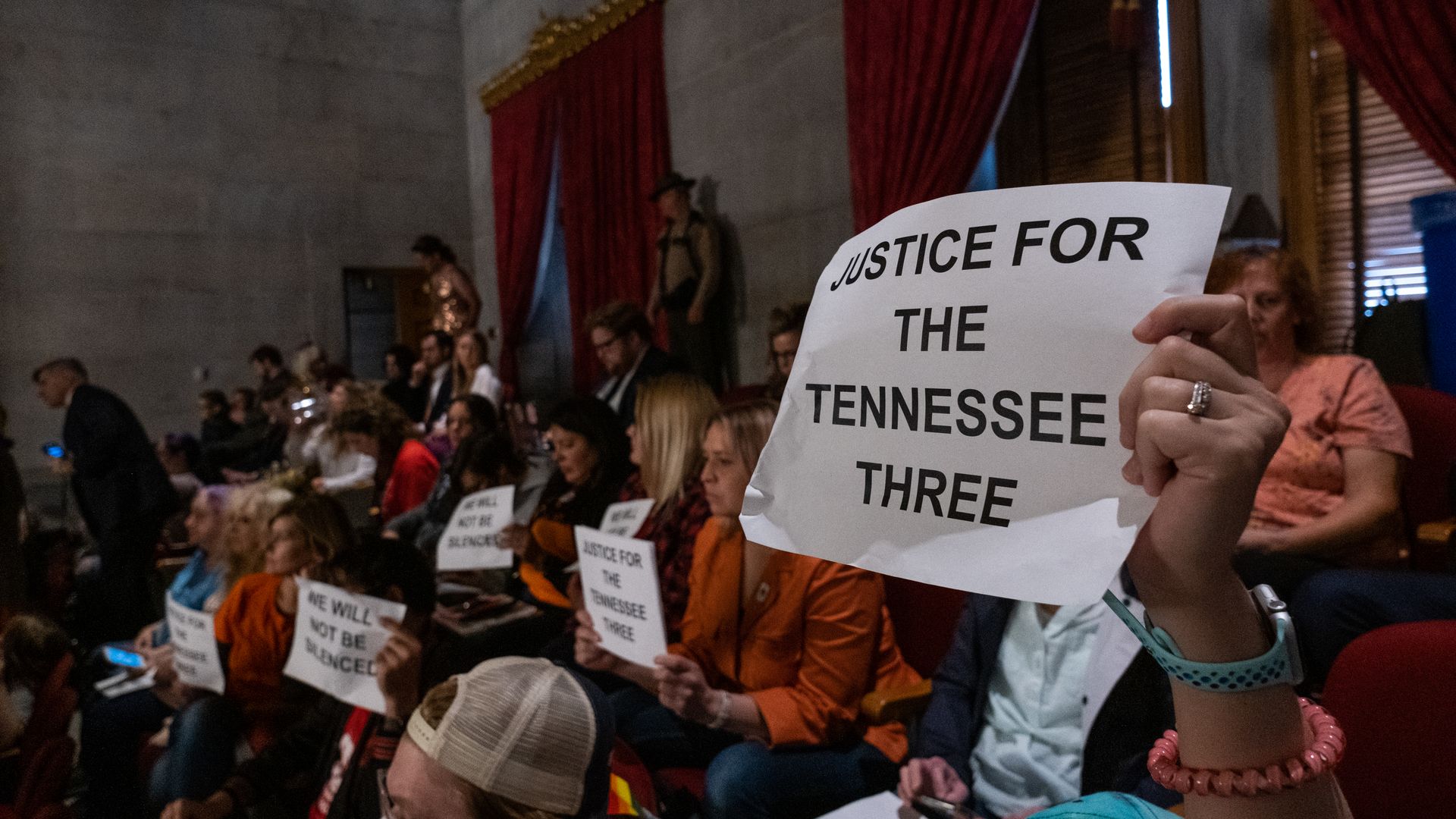 Protesters listen during a house session from the gallery at the Tennessee State Capitol.