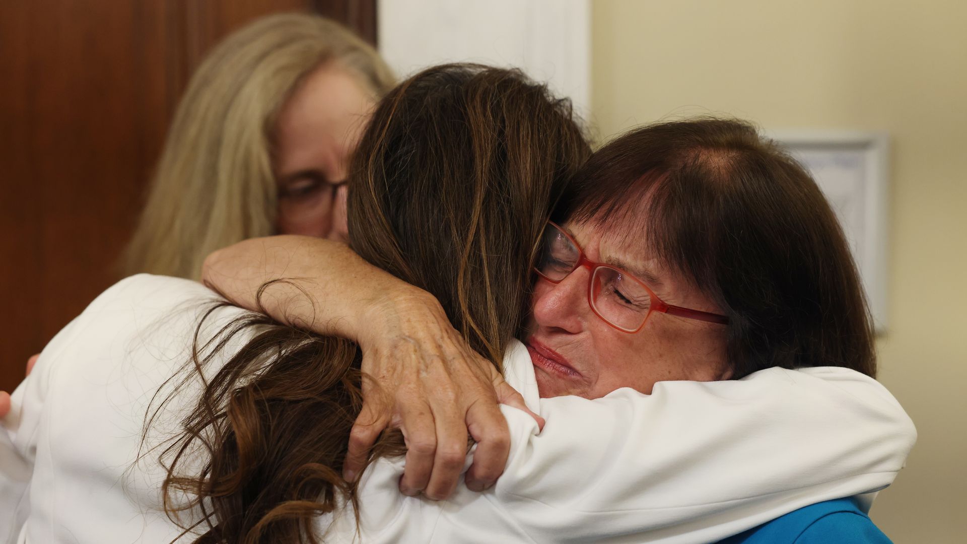 Rep. Ann McLane Kuster (D-NH) (R) hugs Rep. Veronica Escobar (D-TX)