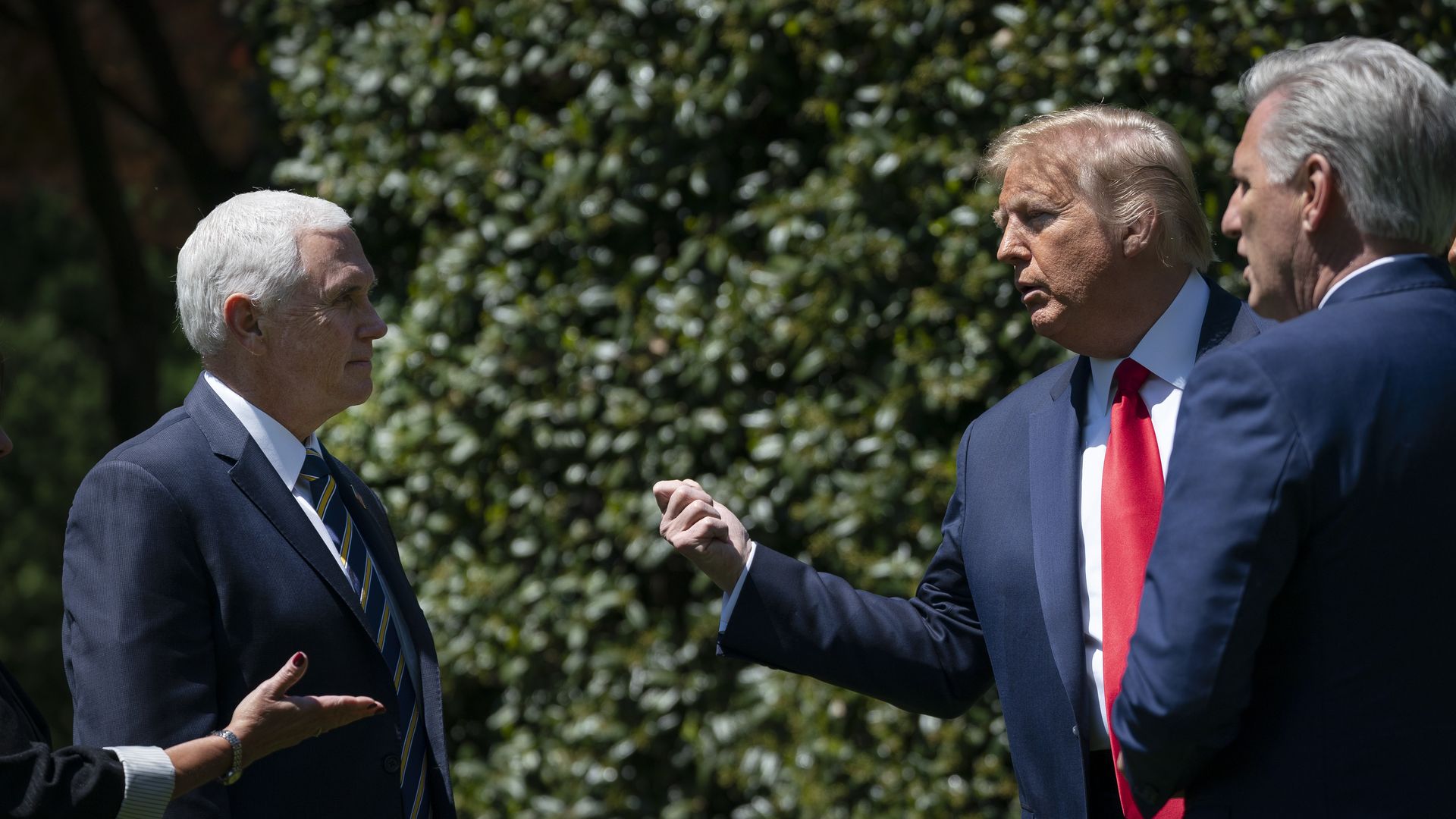 Vice President Mike Pence, U.S. President Donald Trump and House Minority Leader Kevin McCarthy speak together after a tree planting ceremony in recognition of Earth Day and Arbor Day on the South Lawn of the White House on April 22, 2020 