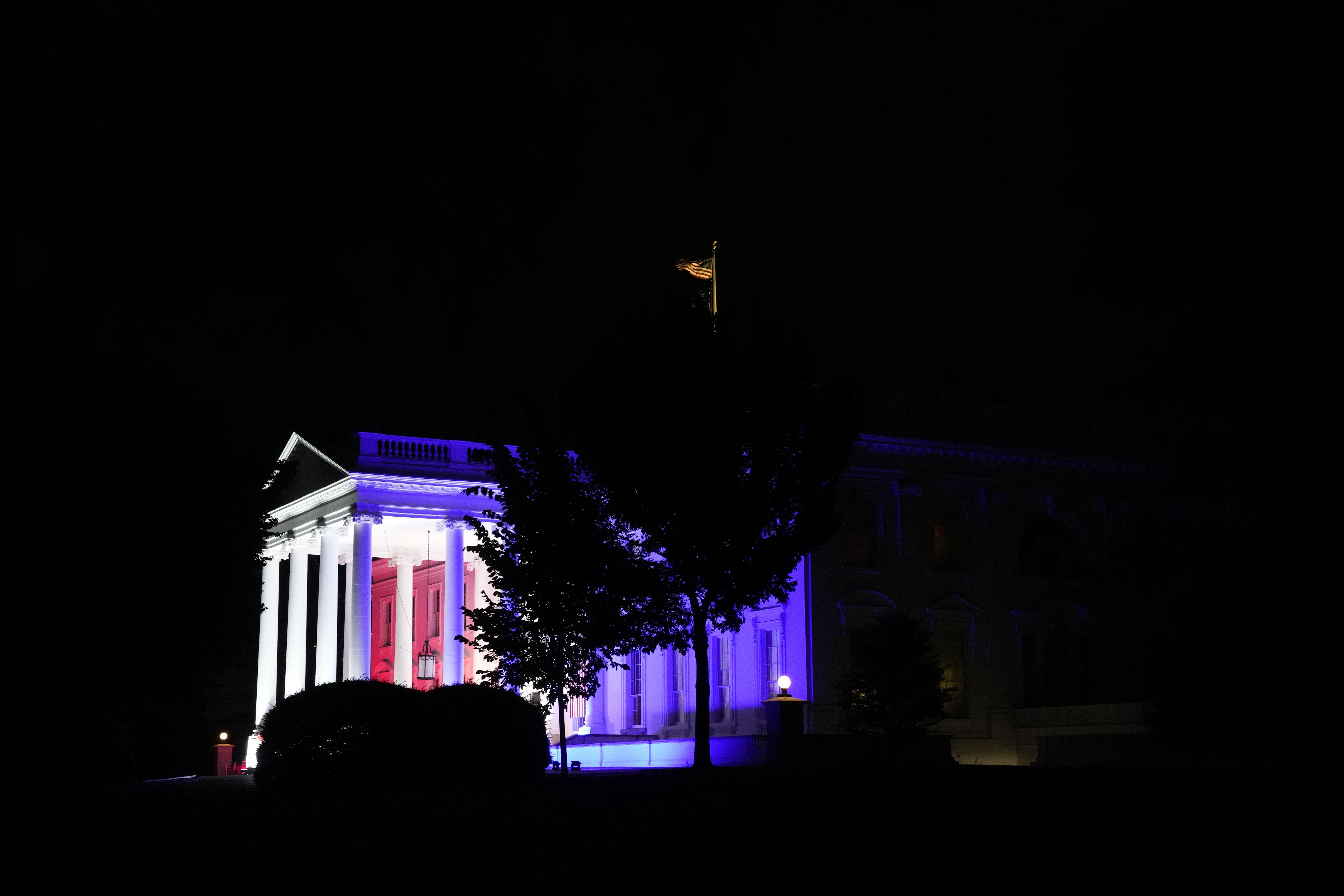 White House lit up in red, white and blue
