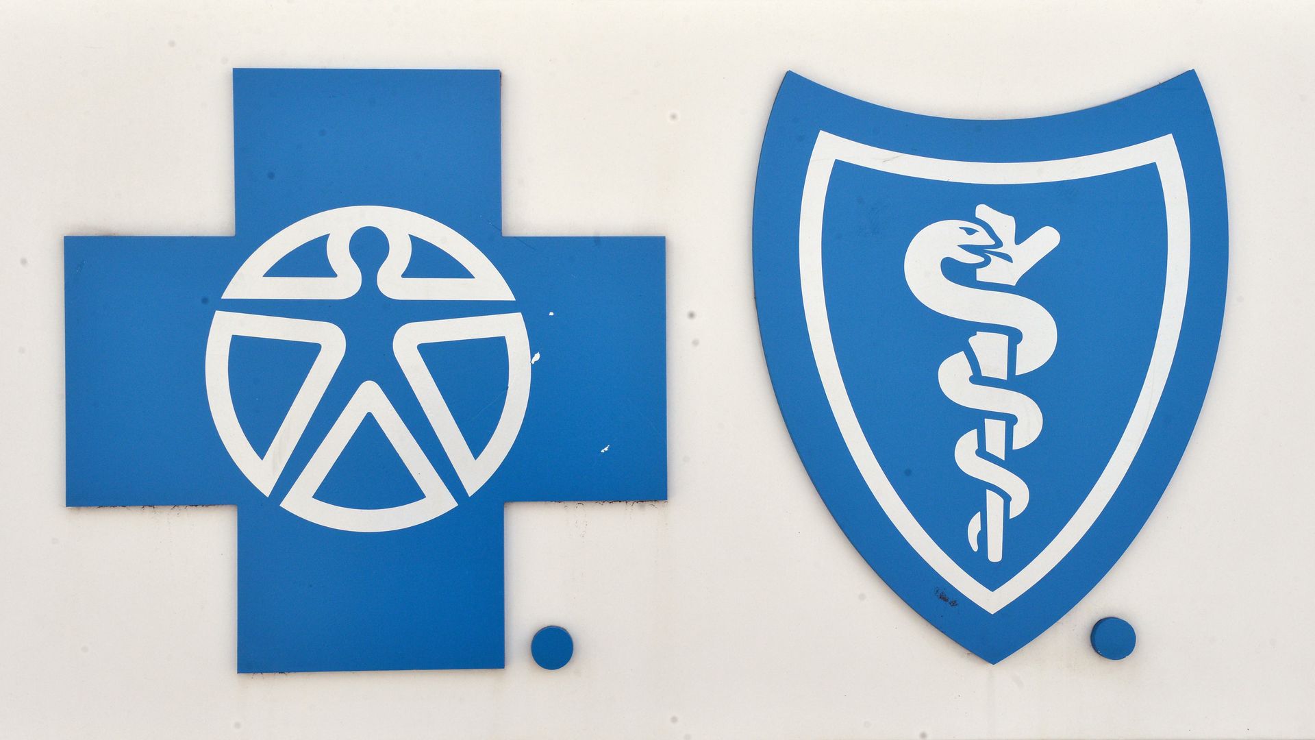 The Blue Cross and Blue Shield logo on a white sign.