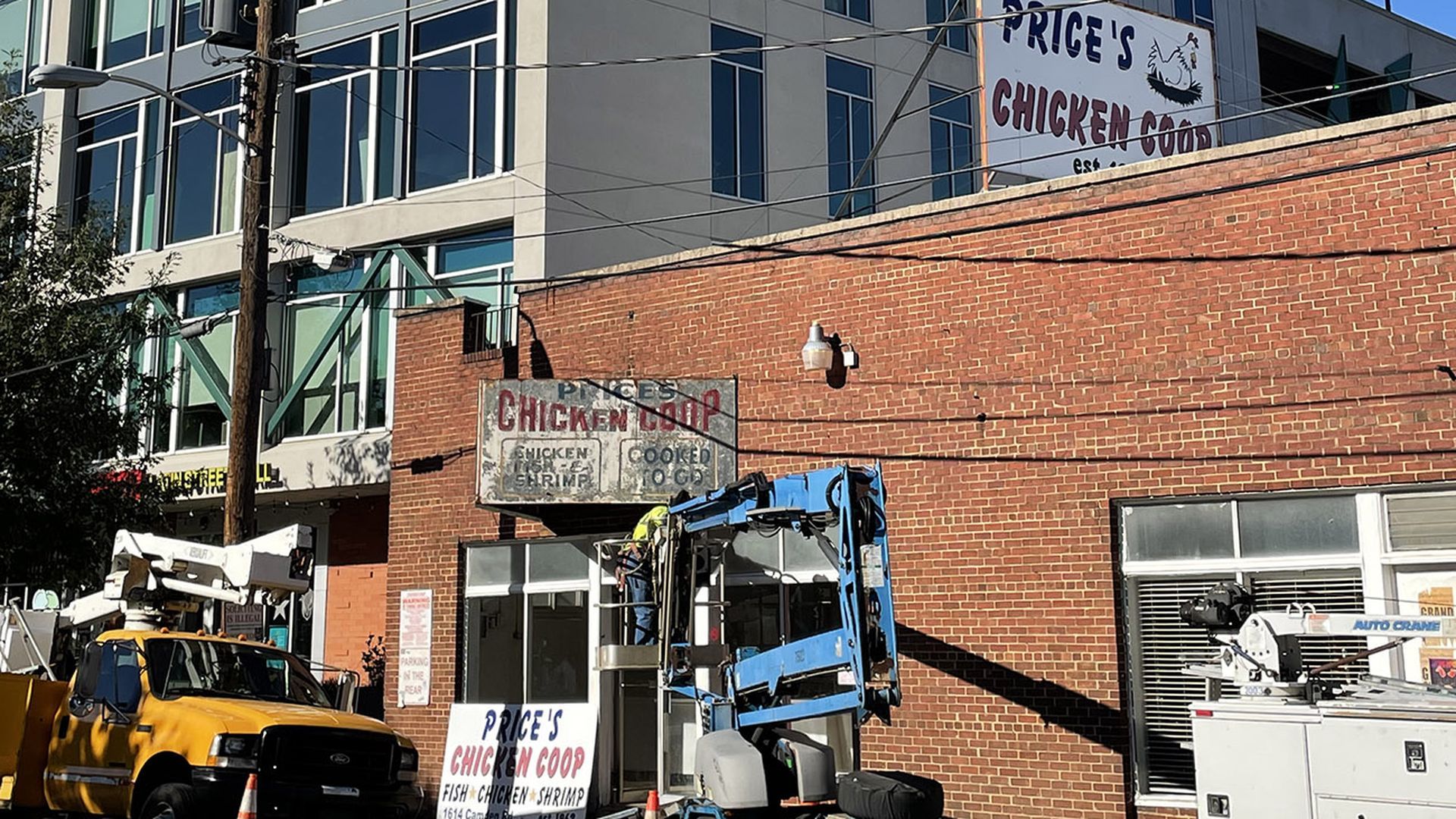 A brick building and sign that says Price's