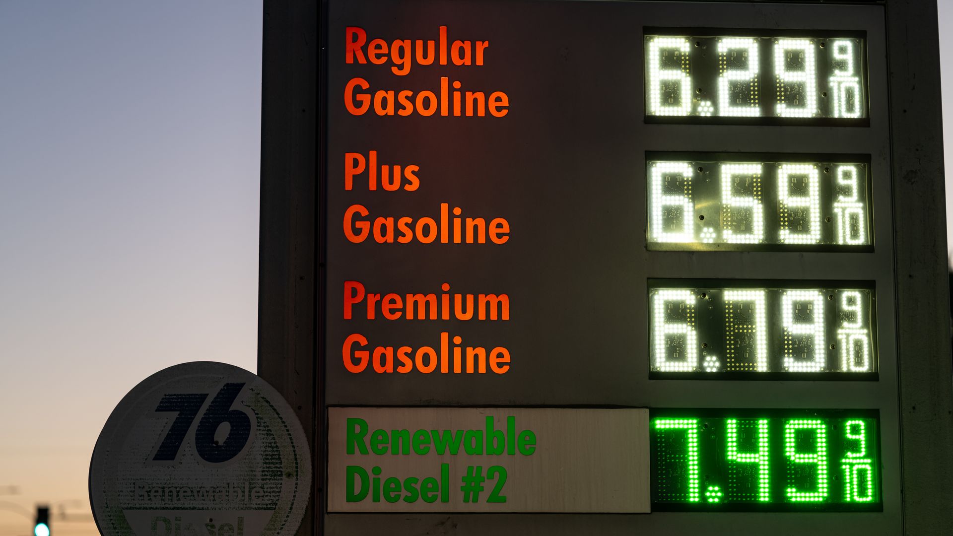 A gas station sign showing prices of $6.29 a gallon for regular, $6.59 a gallon for plus, $6.79 a gallon for premium and $7.49 a gallon for diesel. 