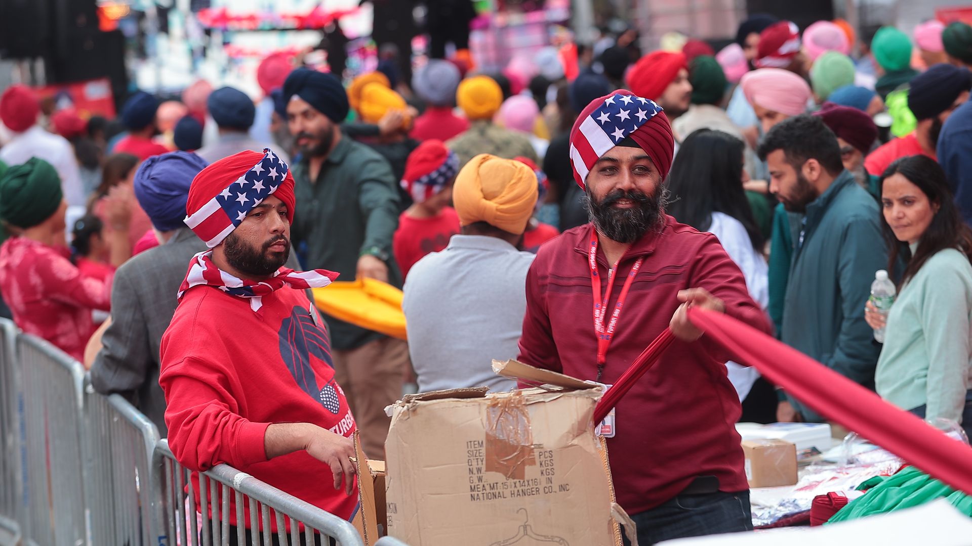 Members of the Sikh community tie colorful turbans on New Yorkers and tourists visiting Times Square for free on May 6, 2023.