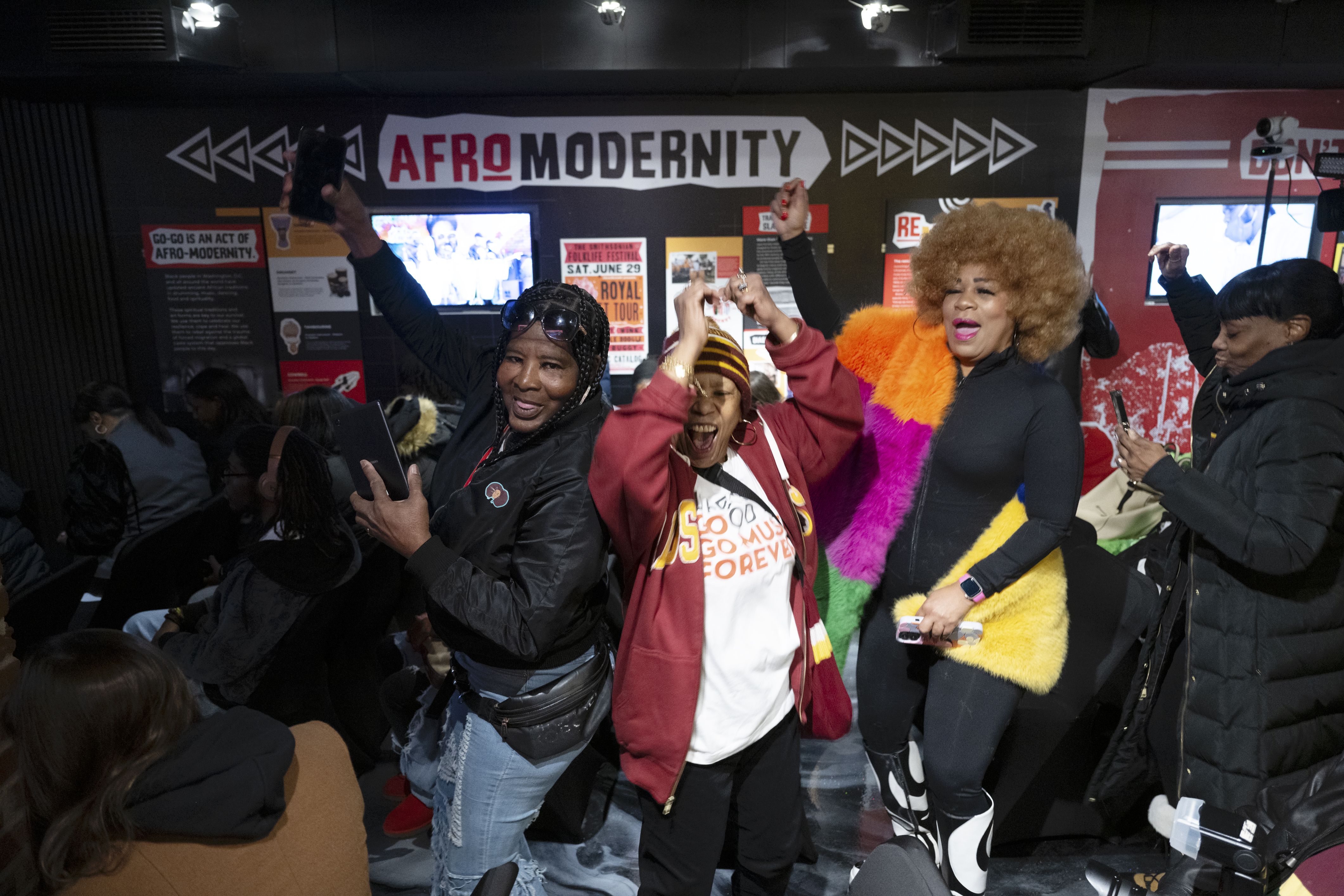 Go go music fans dancing to the grooves at the new Go Go Museum & Cafe in Washington, DC on February 19, 2025. PICTURED, PriscillaThompson (center) Trina (Trina Boo)Edwards (right) go go music's very famous go go music dancer. (Photo by Marvin Joseph/The Washington Post via Getty Images)