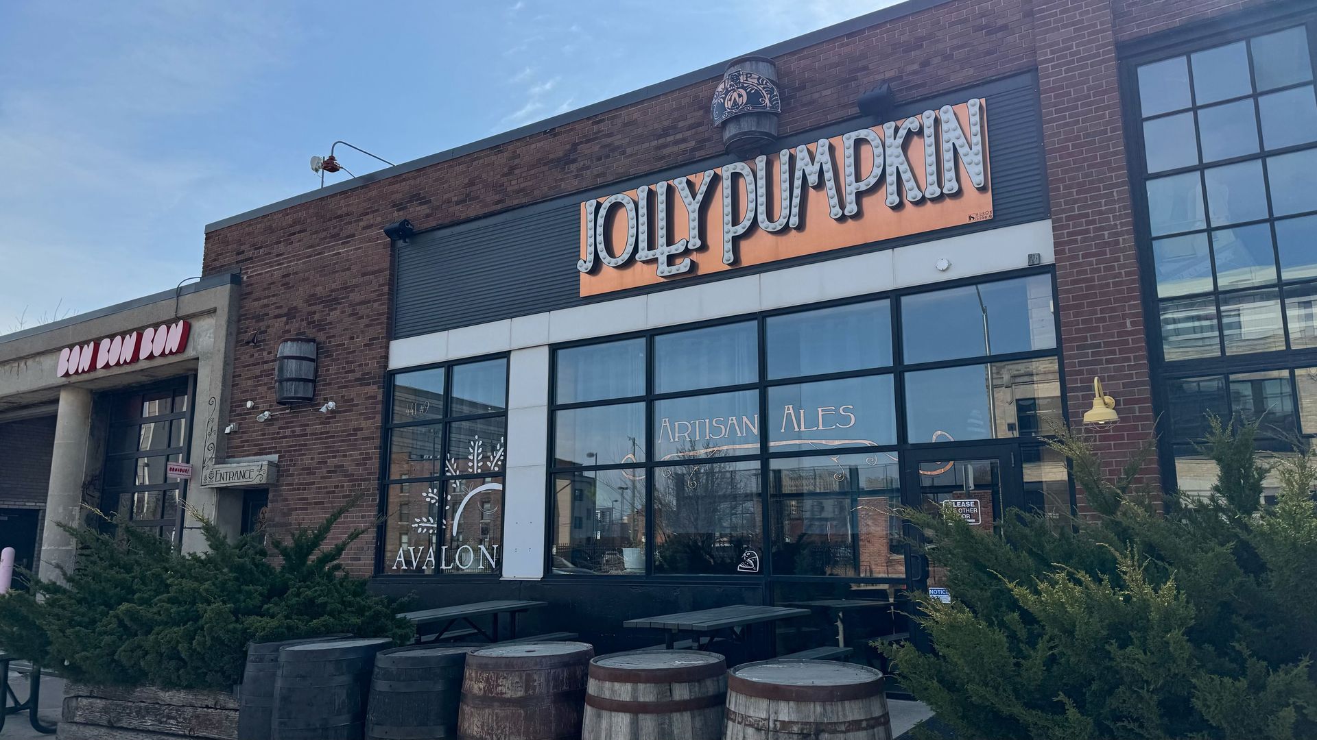 The storefront with a brick facade and giant "jolly pumpkin" letters surrounded by an orange background
