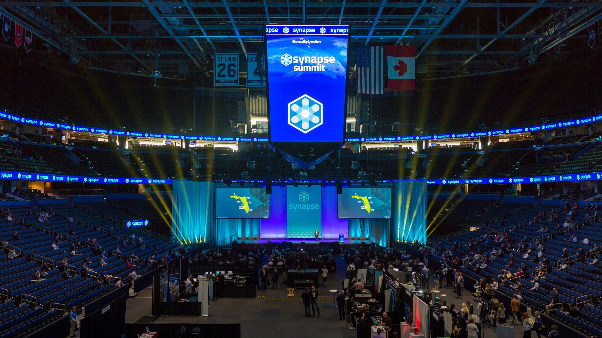 the Synapse Summit banner hanging at Amalie Arena during last year's confrence