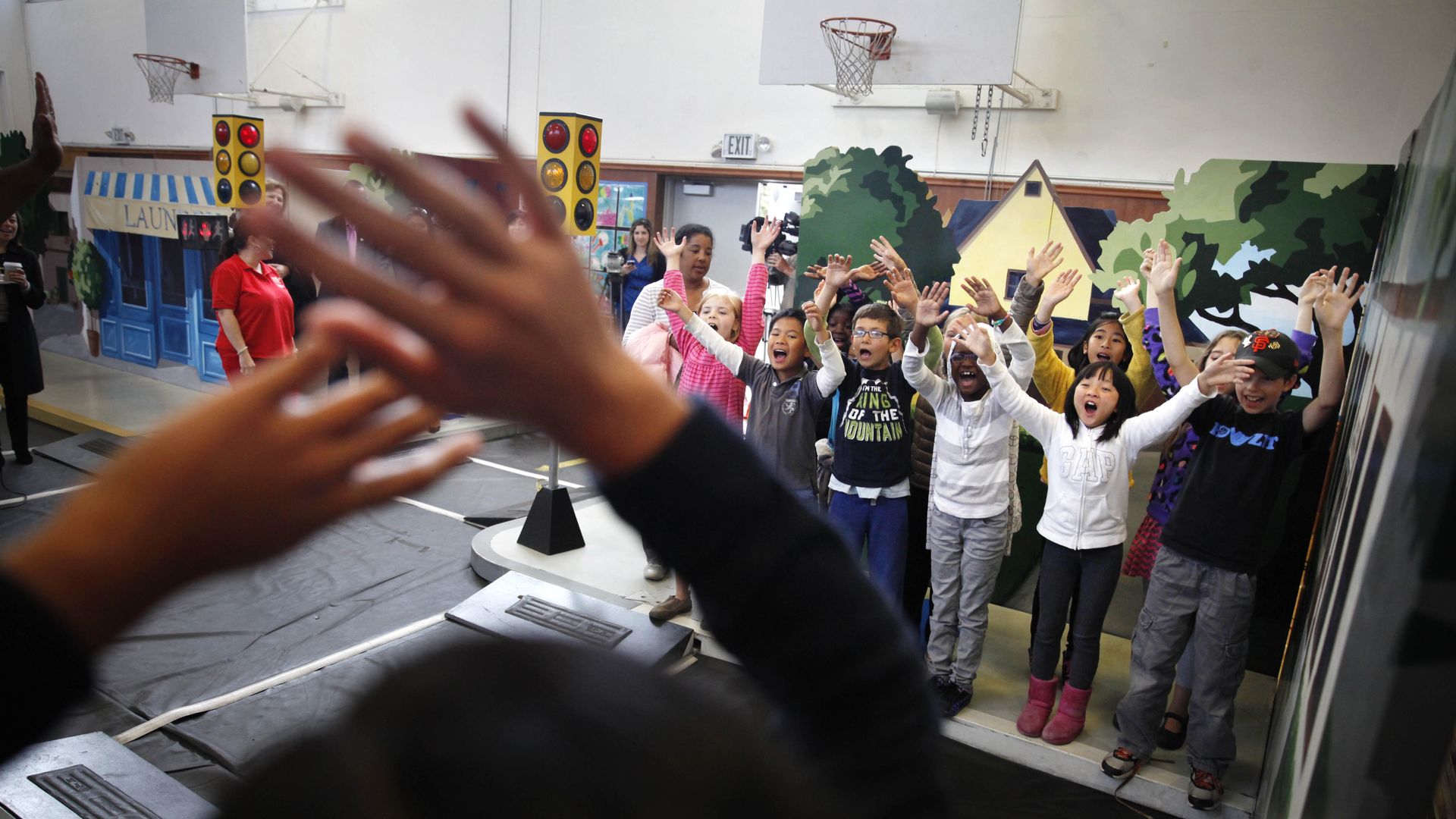 kids with their hands in the air 