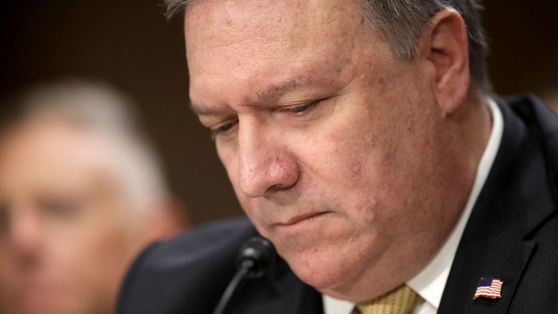 Mike Pompeo looks down, closeup image of his face.