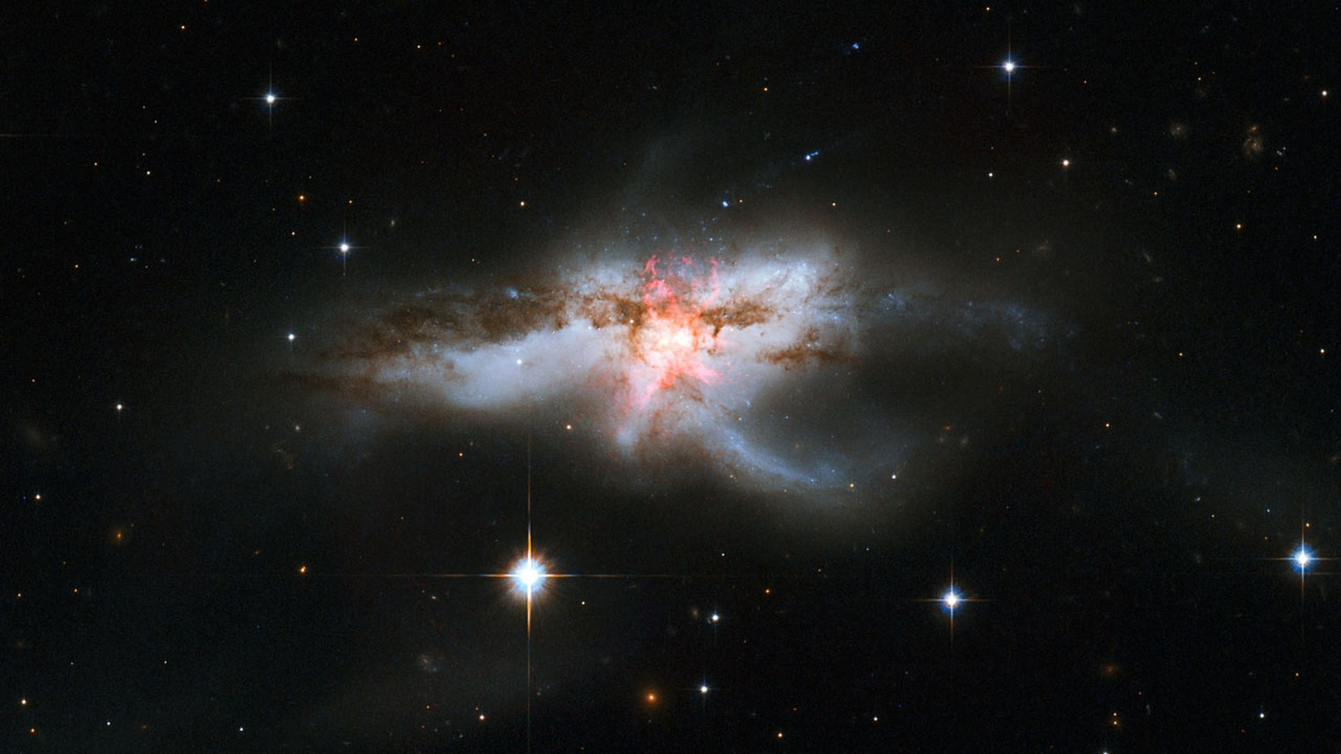 The galaxy NGC 2640 with three supermassive black holes