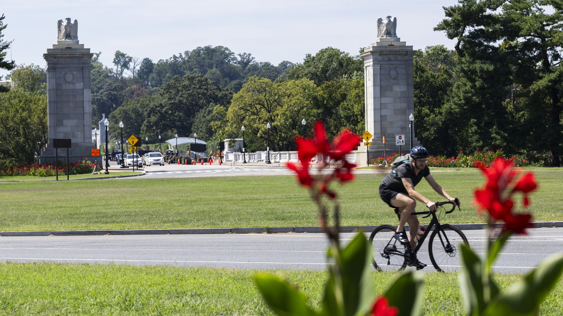 A cyclist makes their way around Memorial Circle.