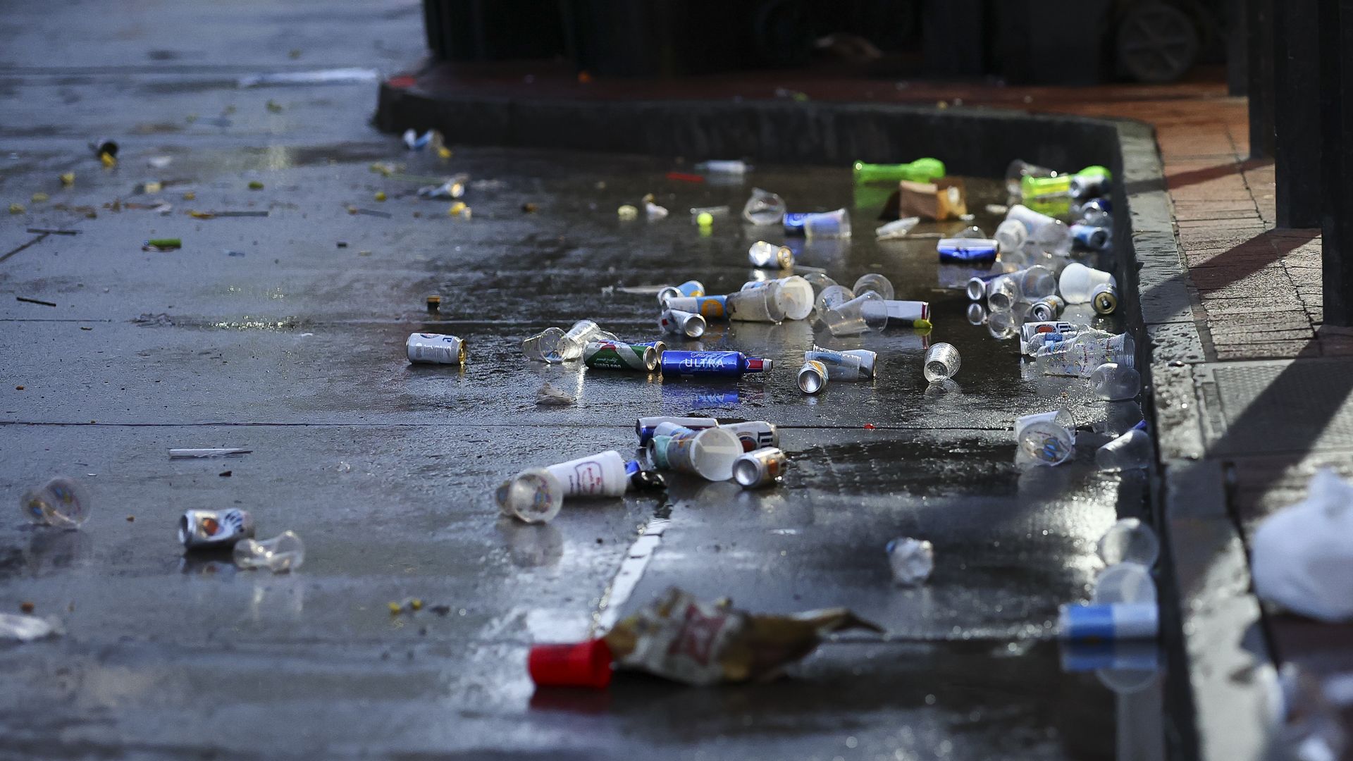 Photo shows trash on the ground.
