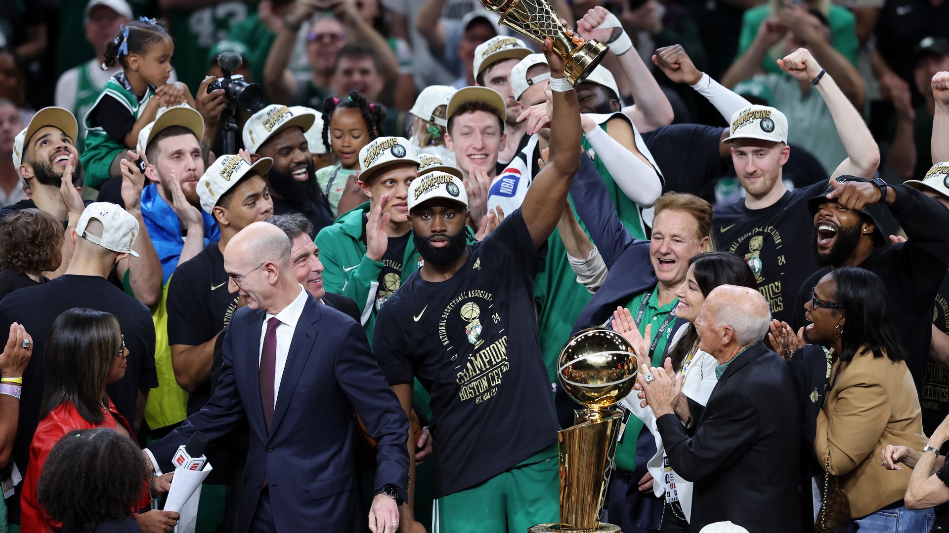  Jaylen Brown #7 of the Boston Celtics holds up the Bill Russell NBA Finals Most Valuable Player award after Boston's 106-88 win against the Dallas Mavericks in Game Five of the 2024 NBA Finals at TD Garden.