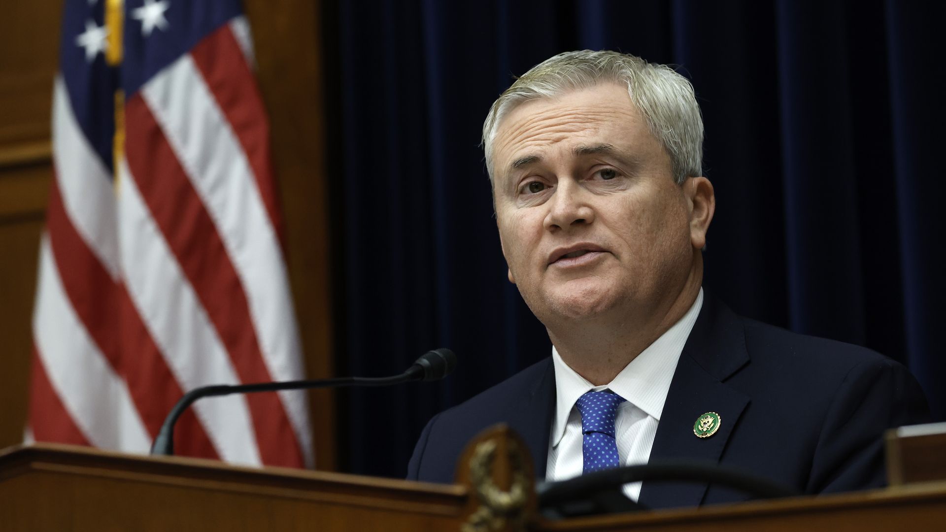 James Comer sits before a microphone