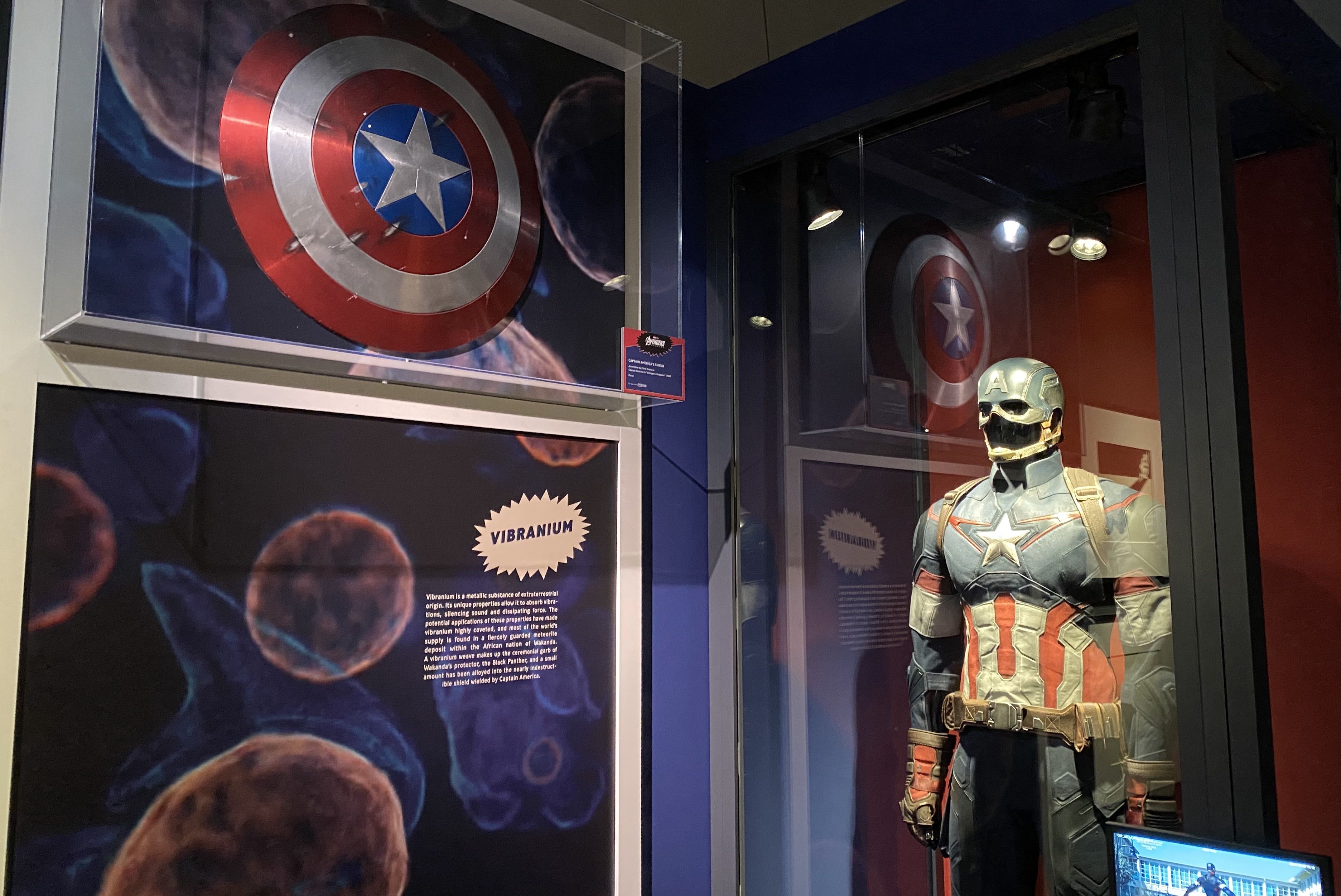 A Captain America costume and shield exhibit