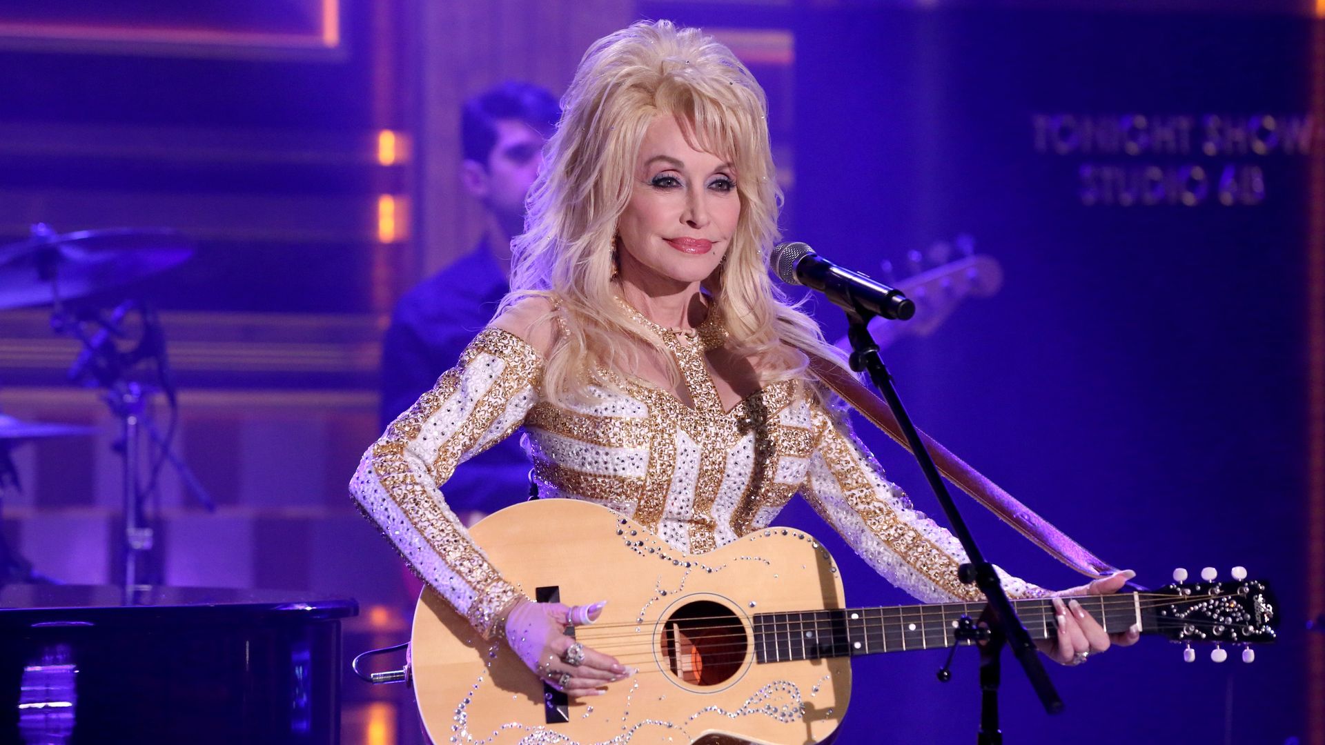 Dolly Parton performing onstage.