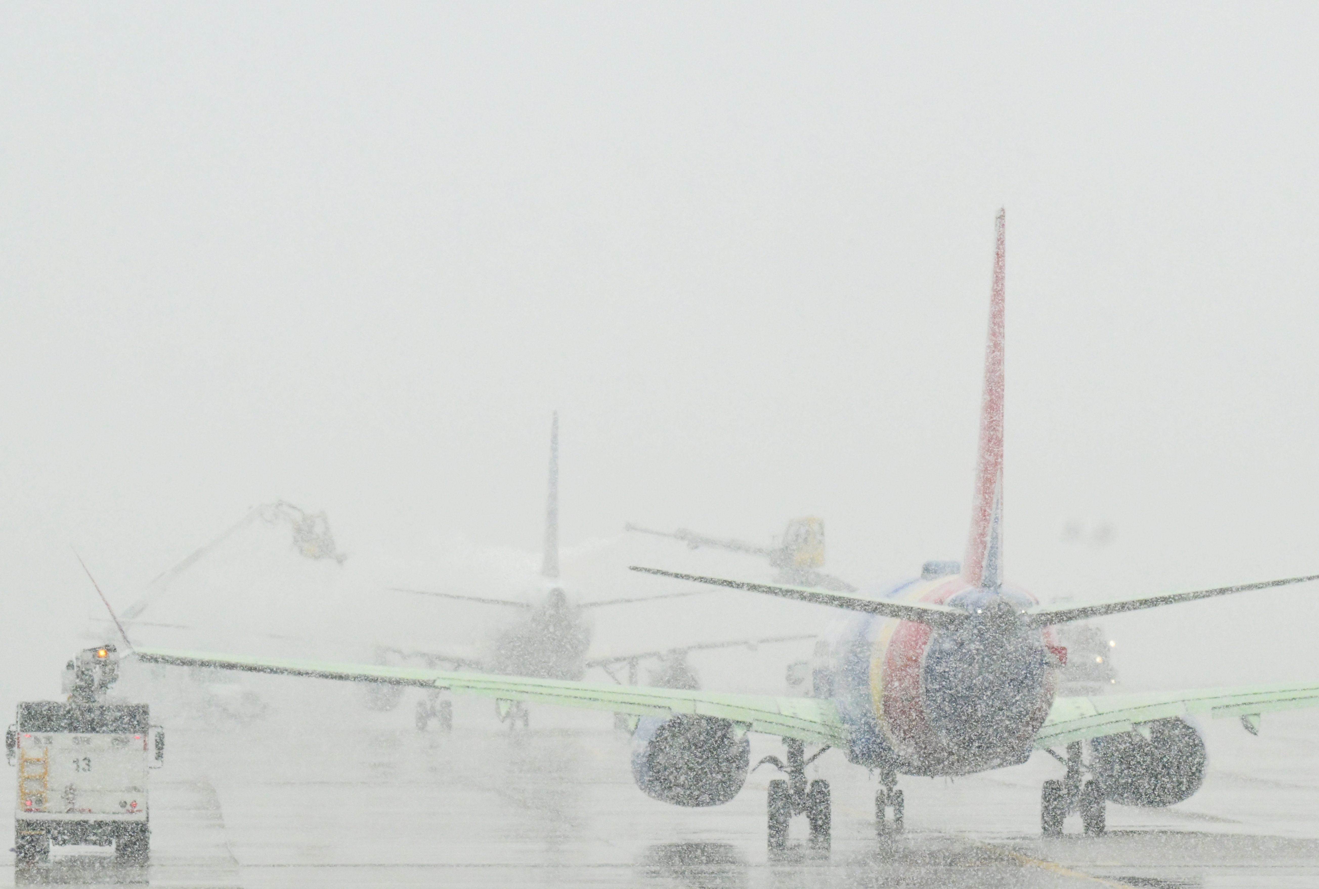 Planes line up for de-icing at Denver International Airport. Photo: RJ Sangosti/Denver Post via Getty Images