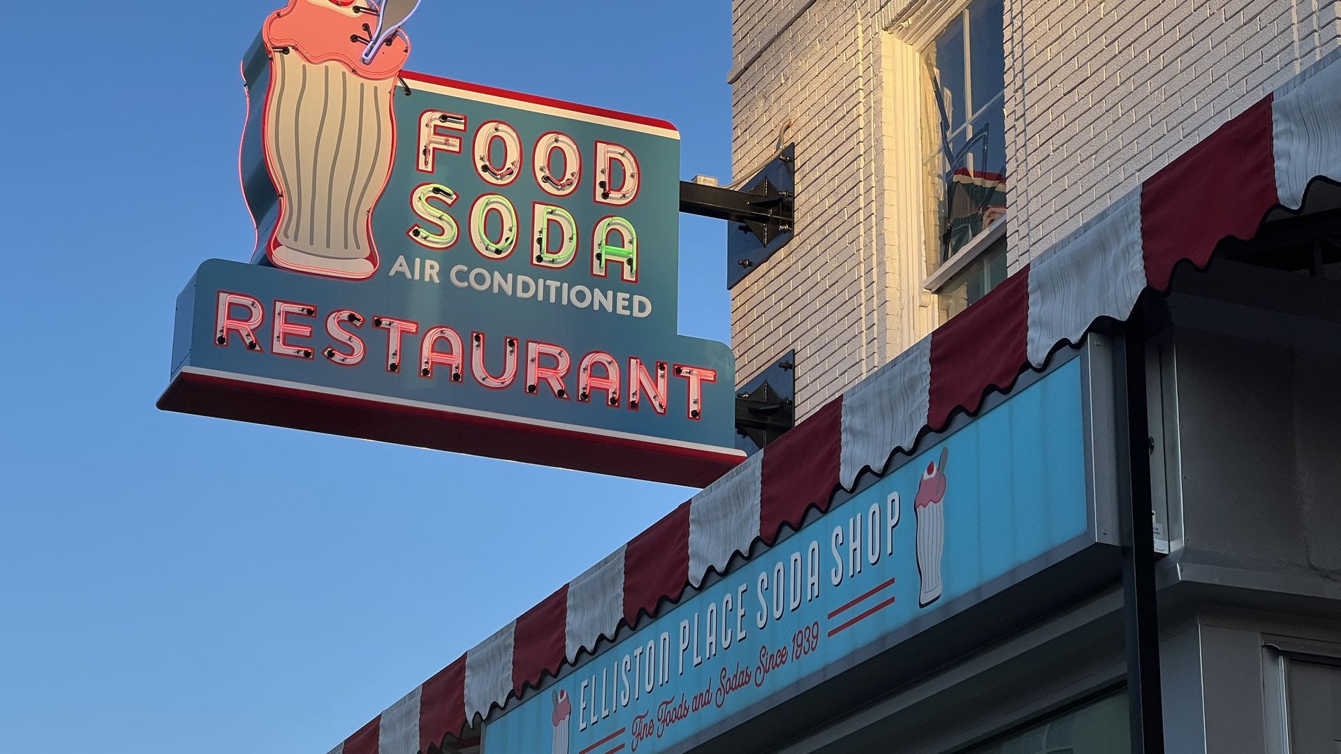 The exterior blue and pink sign of Elliston Place Soda Shop in Nashville.