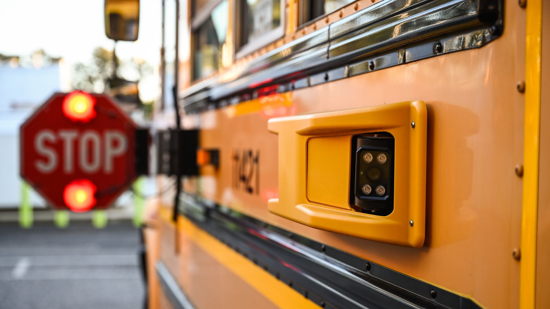 Close-up of a camera attached to a school bus.