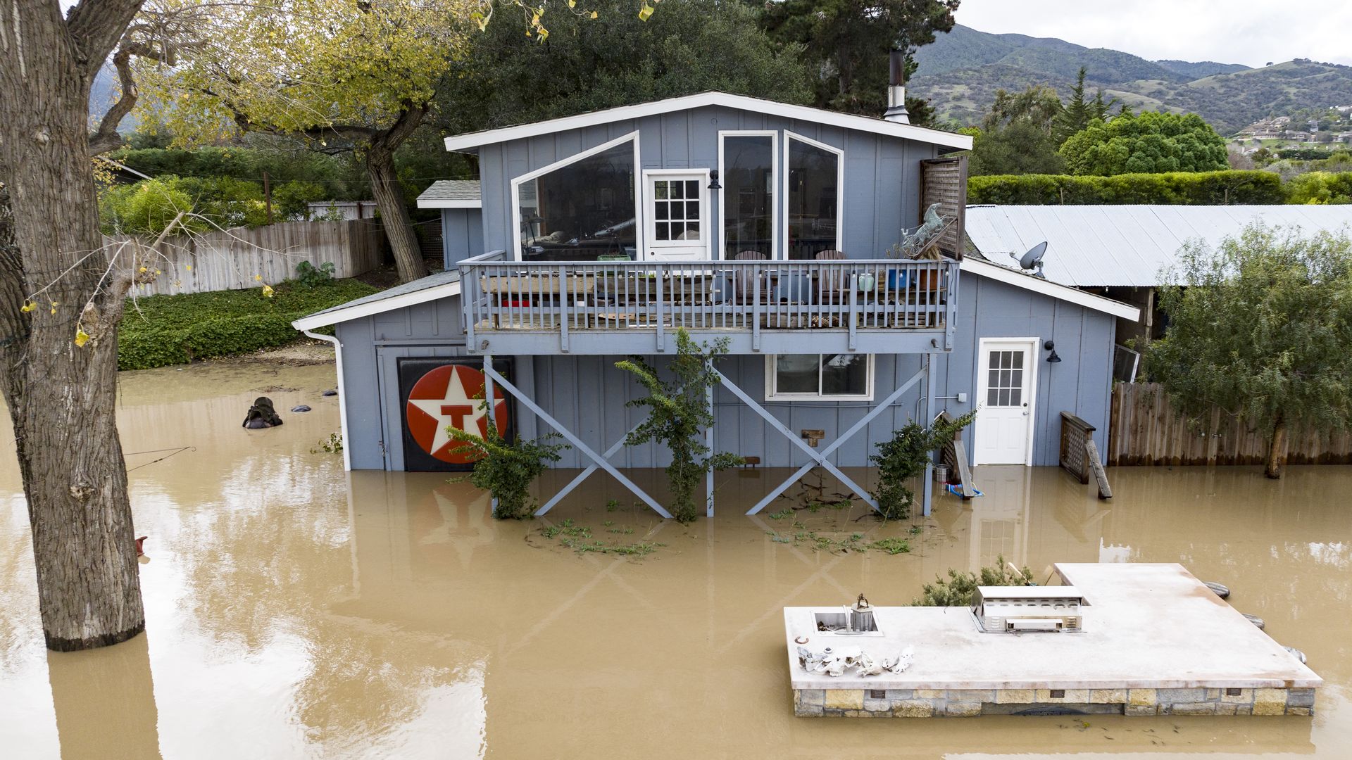Floodwaters from the overflowing Salinas River surround a home in Salinas, California, on Jan. 13.