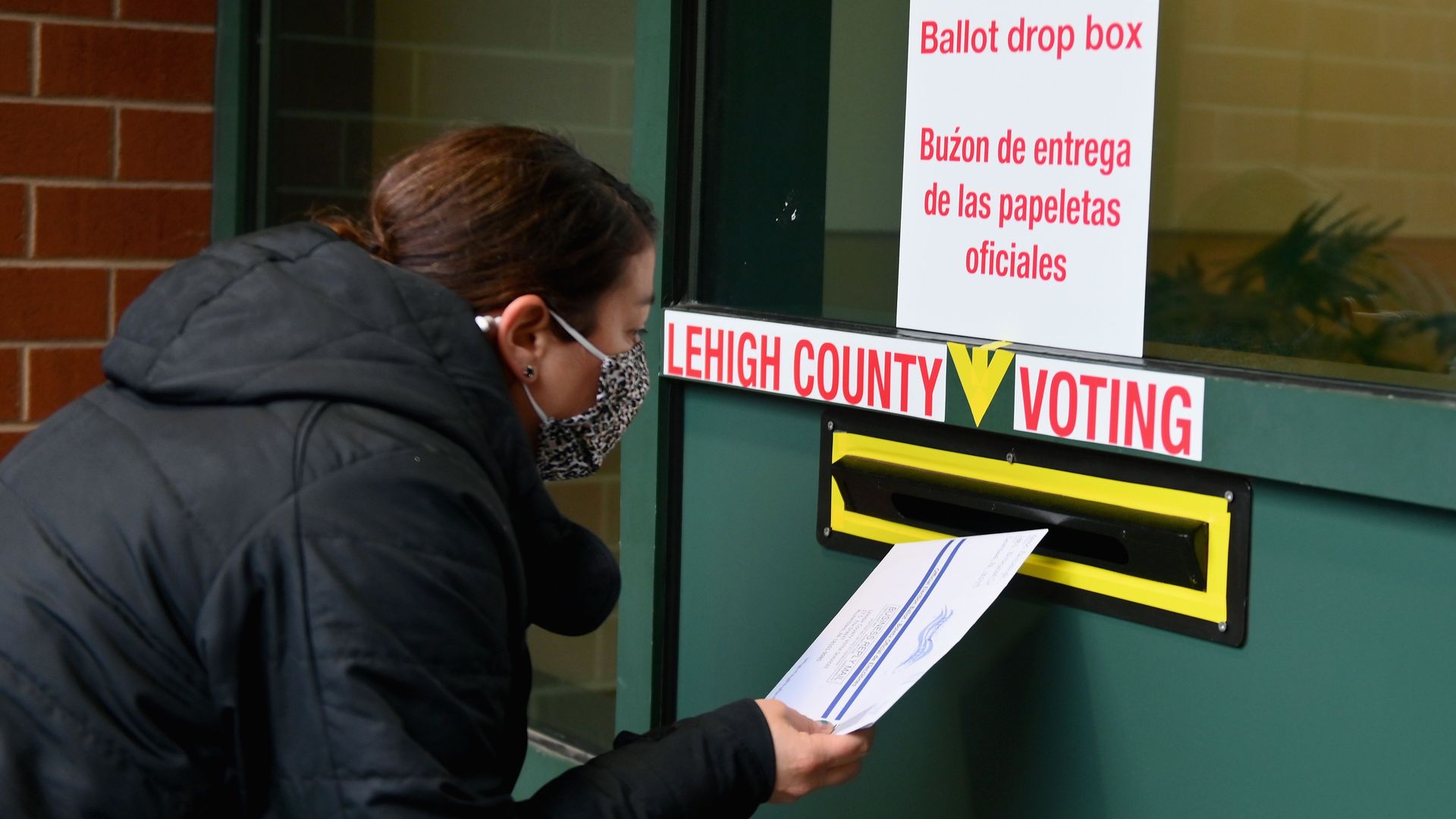 A voter arrives to drop off her ballot during early voting in Allentown, Pennsylvania on Oct. 29, 2020.