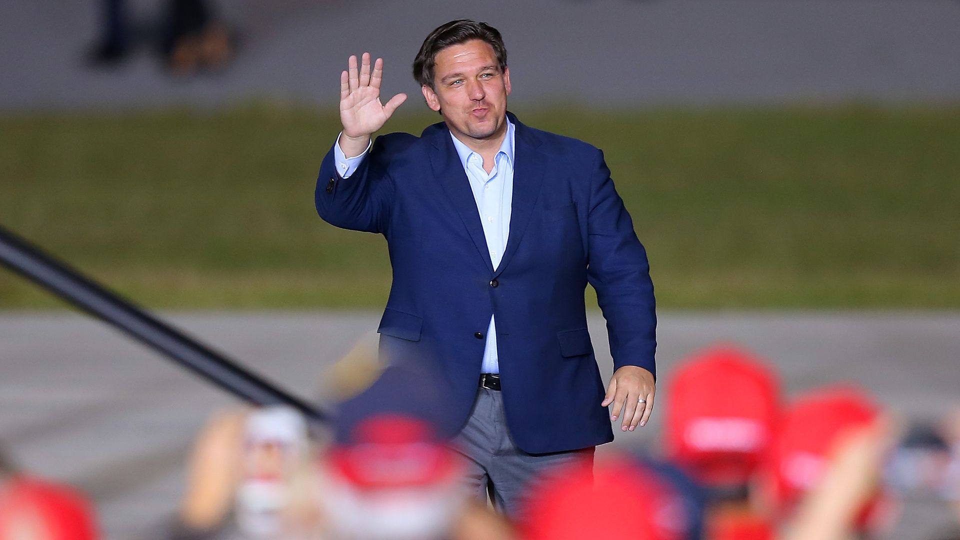 Florida Governor Ron DeSantis waves to supporters during a rally for President Donald Trump