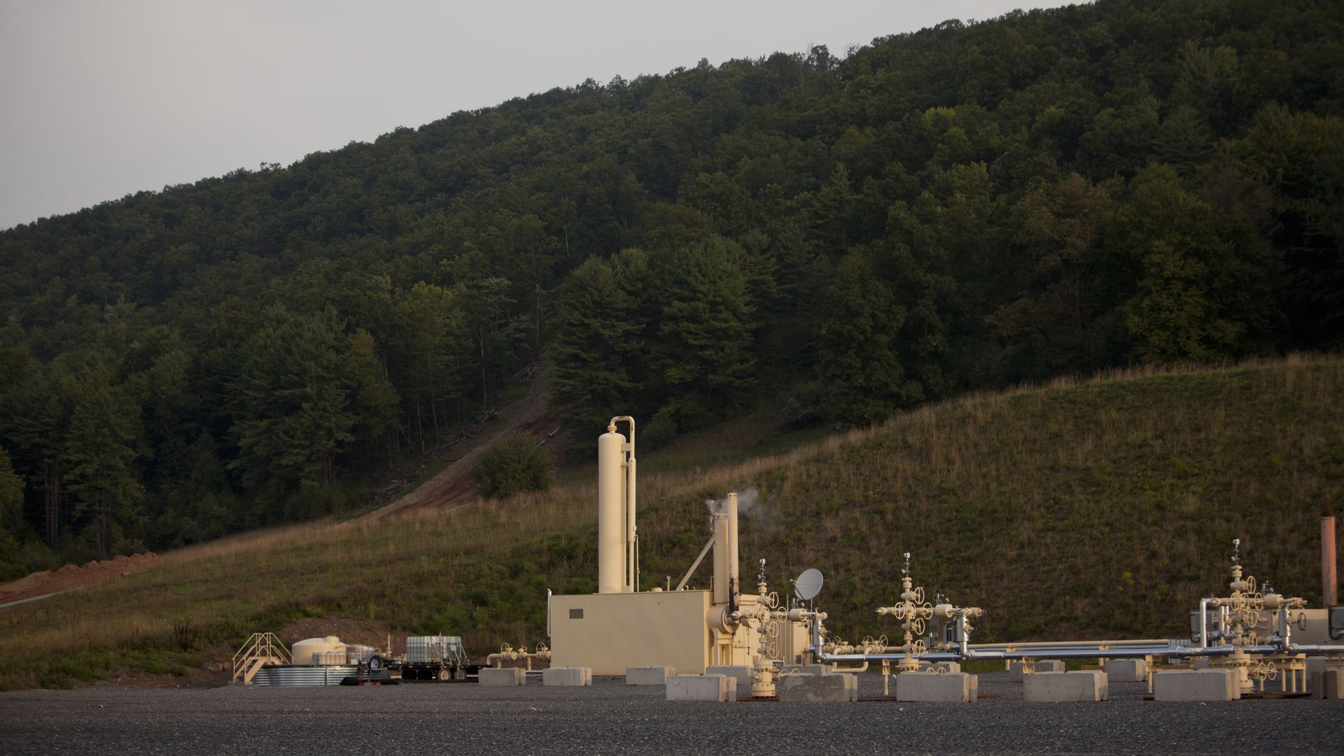 natural gas processing facility with tanks and pipes