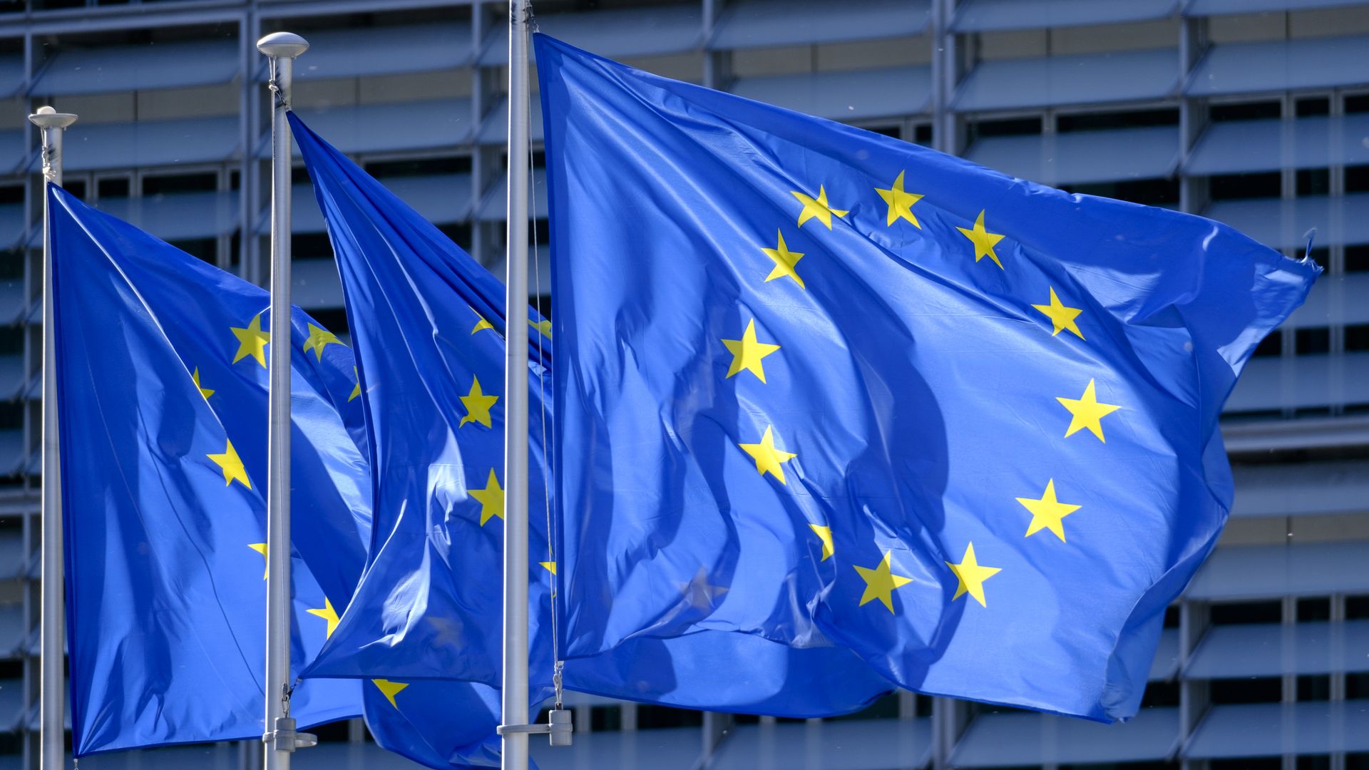 The EU flags are seen in front of the Berlaymont, the EU Commission headquarter