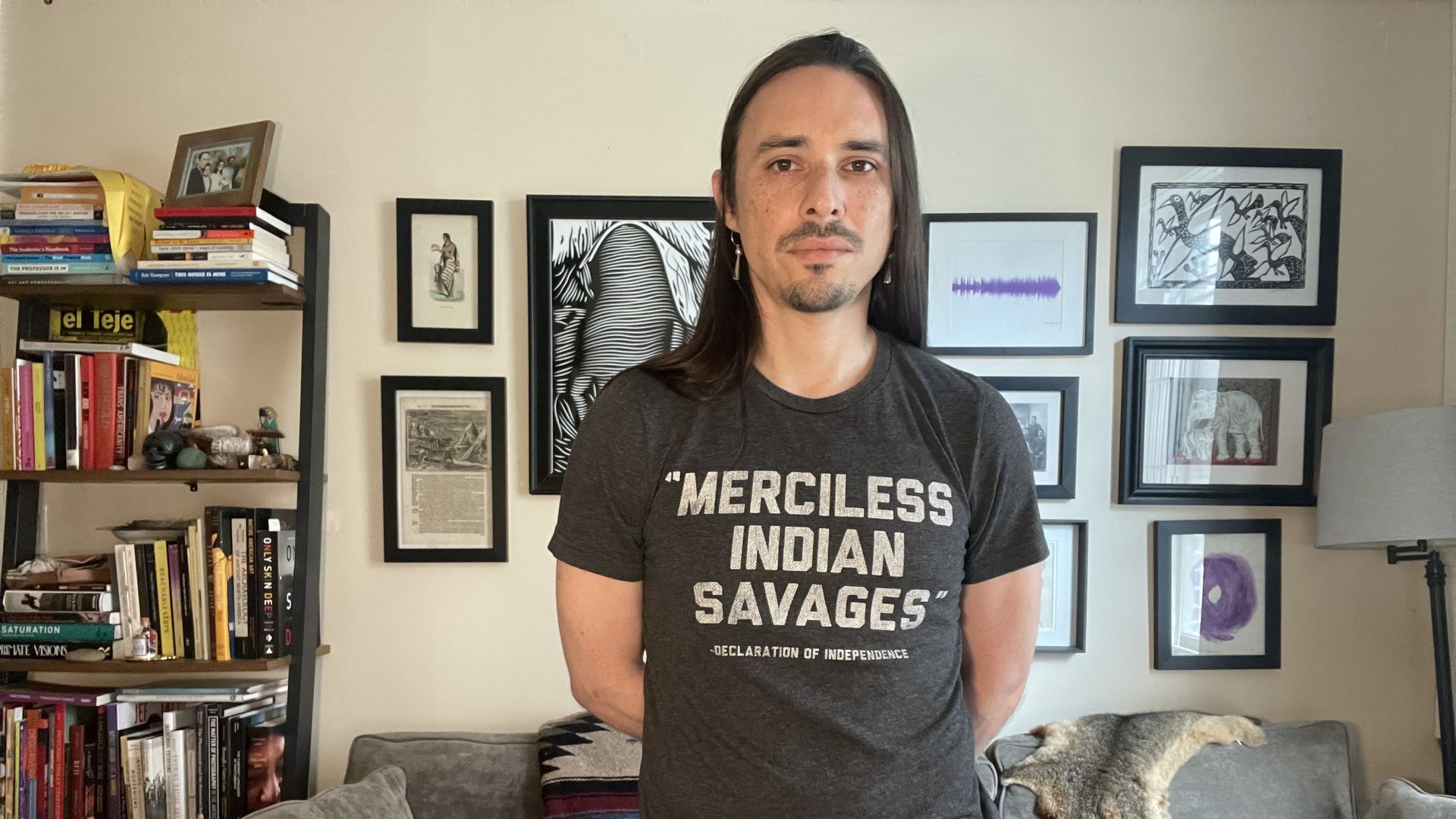 Stony Brook University Hispanic and Literature associate professor Joseph M. Pierce, a citizen of the Cherokee Nation, poses with "Merciless Indian Savages" t-shirt.