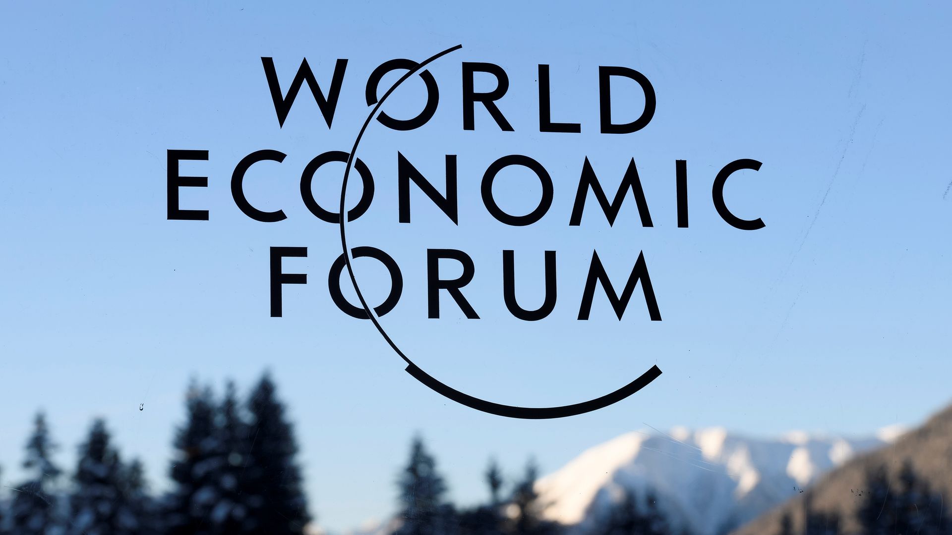  A sign and logo of the World Economic Forum in Davos