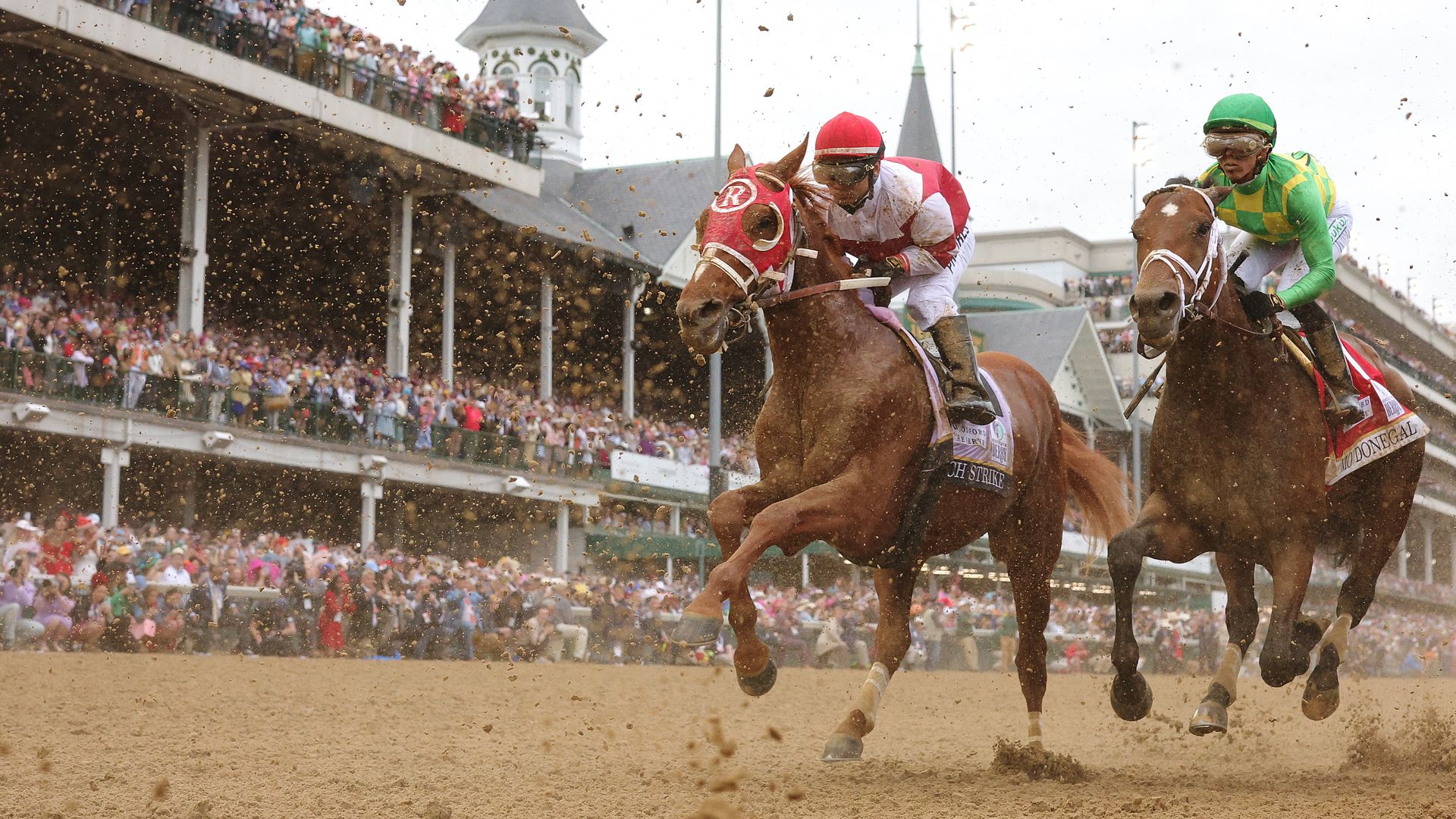 Rich Strike (L) with Sonny Leon up and Mo Donegal (R) with Iran Ortiz Jr. at the Kentucky Derby. 