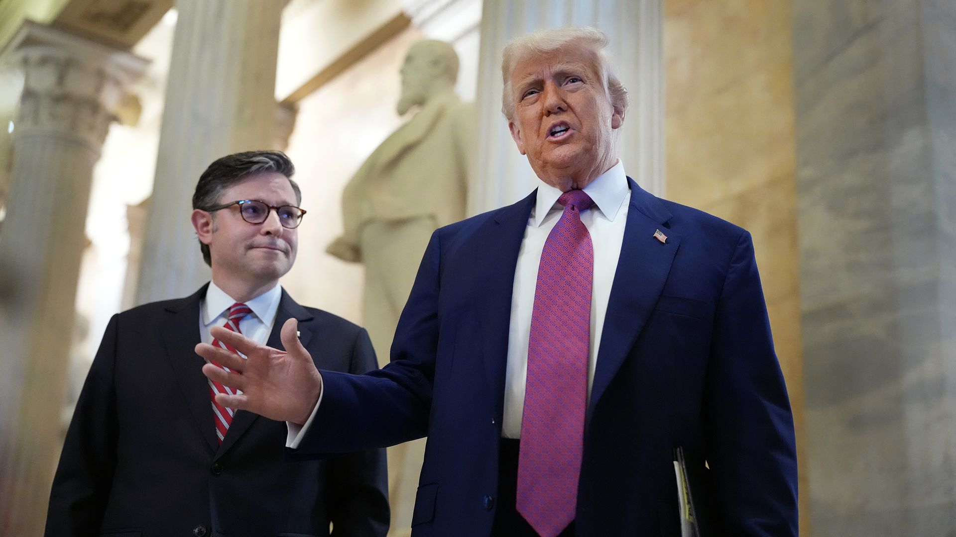 President Trump arrives with Speaker of the House Mike Johnson (R-LA) for a House Republican meeting at the U.S. Capitol on May 20.