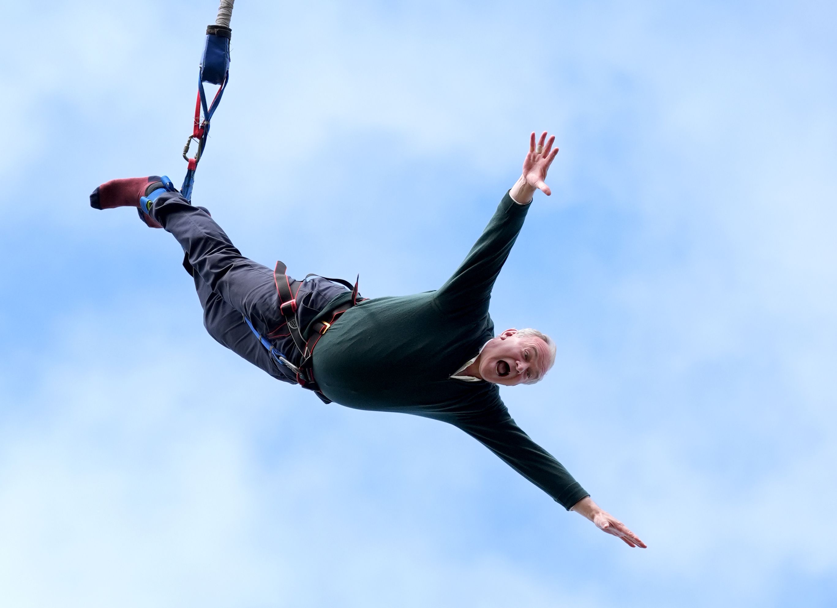 Liberal Democrat leader Sir Ed Davey taking part in a bungee jump during a visit to Eastbourne Borough Football Club in East Sussex, while on the General Election campaign trail