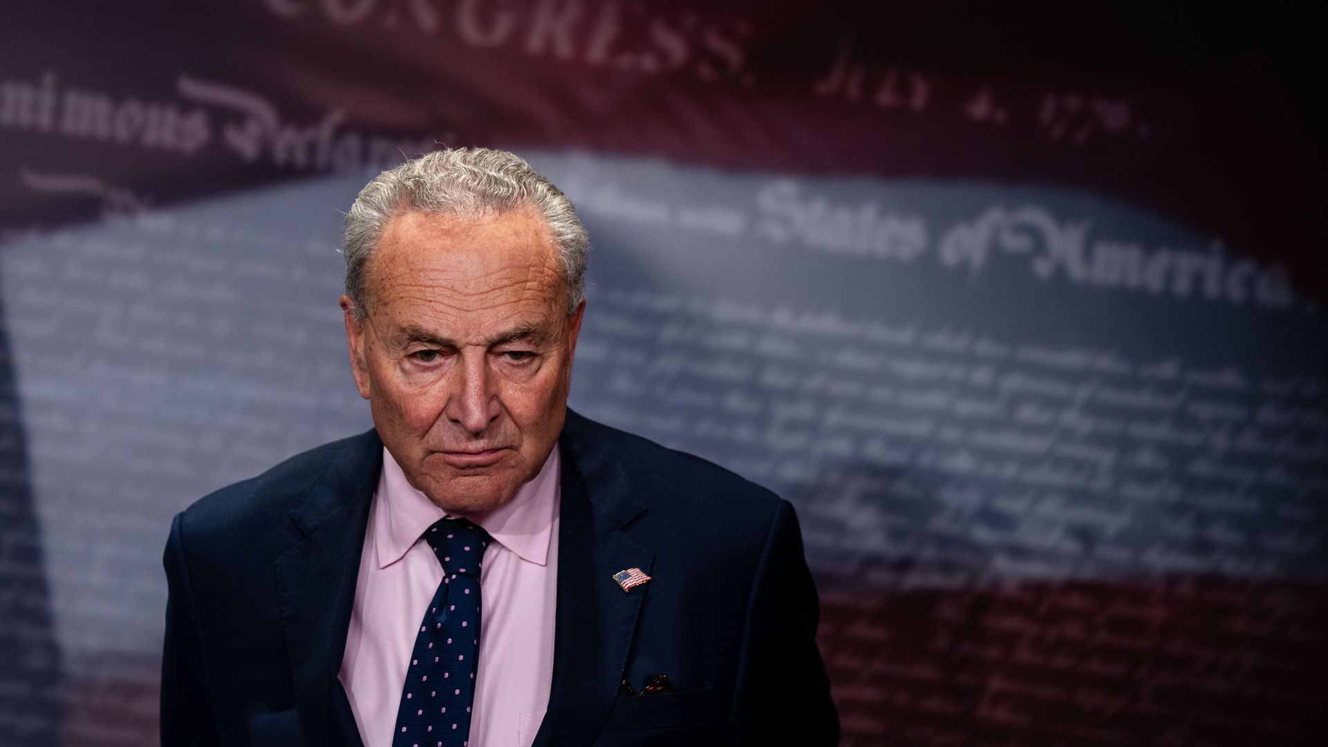 Senate Majority Leader Chuck Schumer (D-NY) listens as Sen. Ron Wyden (D-OR) speaks during a news conference on the need to pass bipartisan tax relief for American families on July 31, 2024 in Washington, DC. 