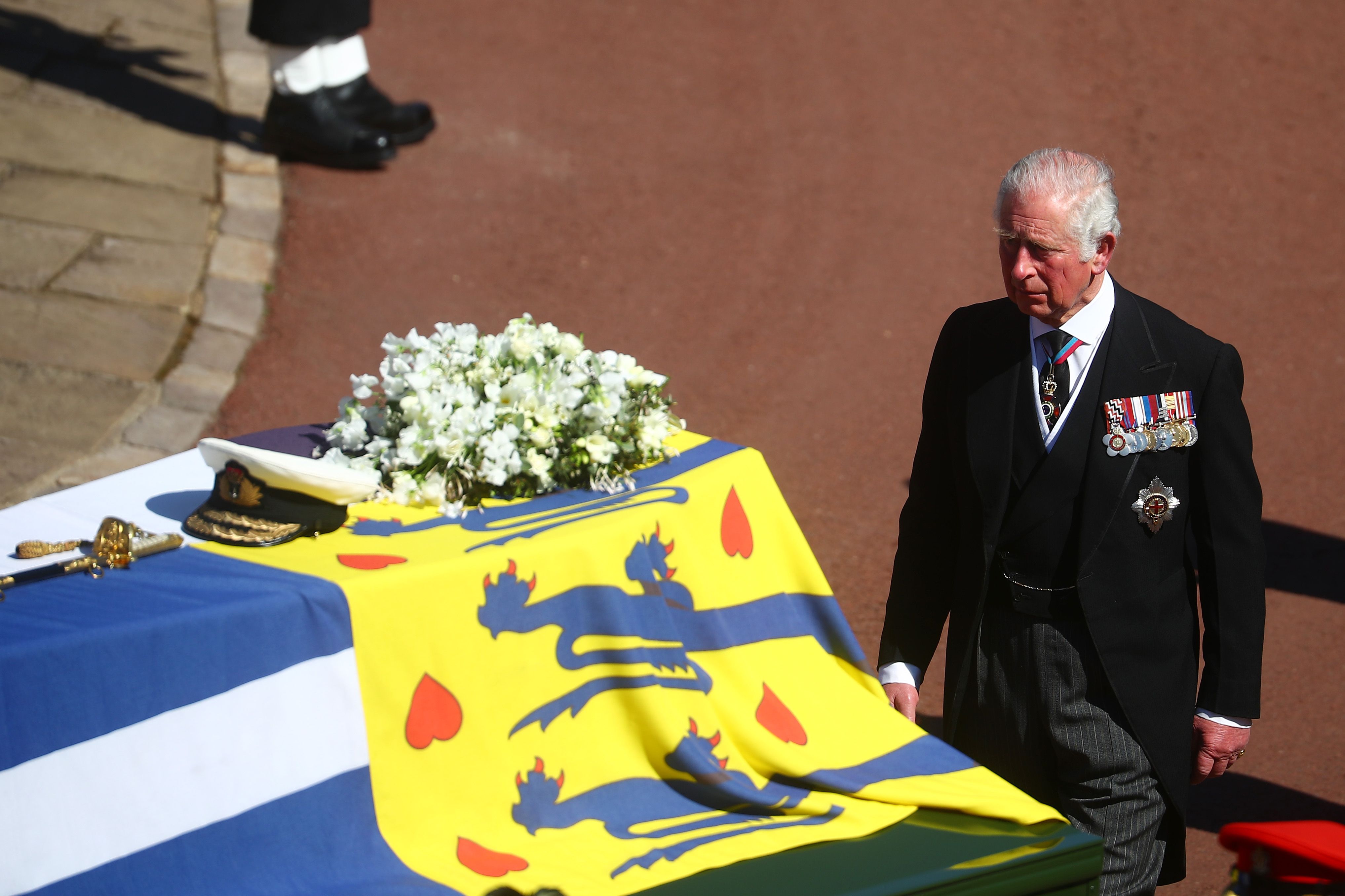 Photo of Prince Charles walking behind Prince Philip's coffin