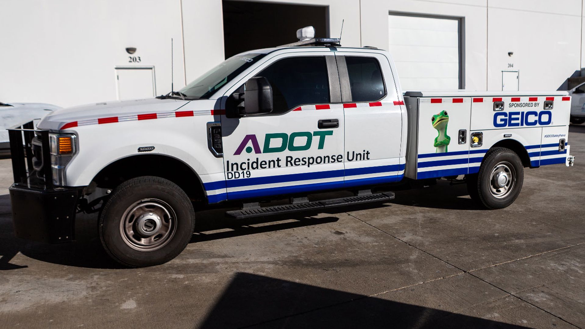 An ADOT truck with the GEICO gecko