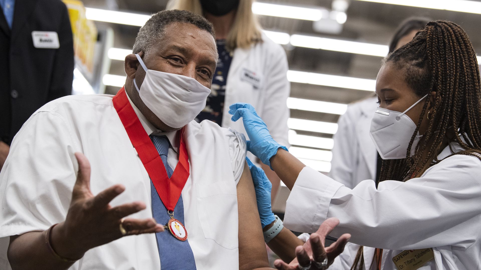 A man receives a Pfizer covid-19 vaccine booster shot at the Safeway on Capitol Hill in October.