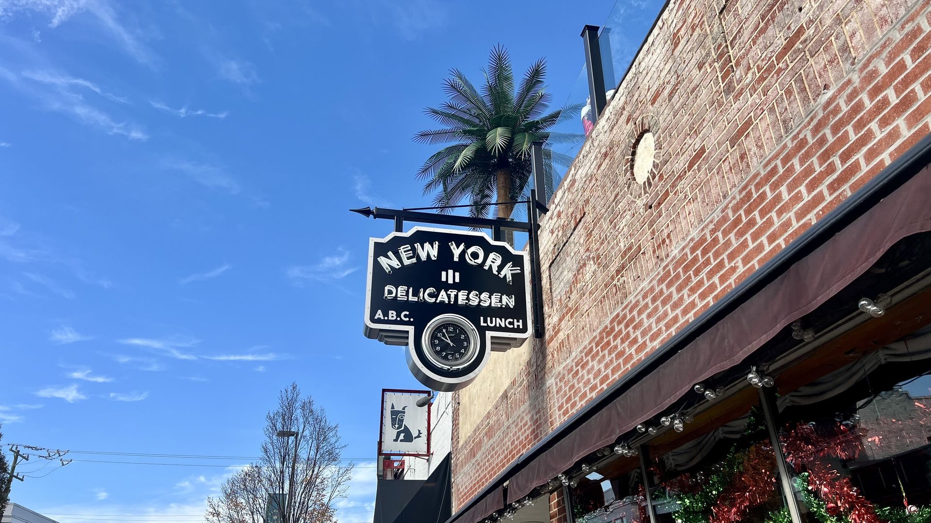 an old looking restaurant sign that says New York Delicatessen 