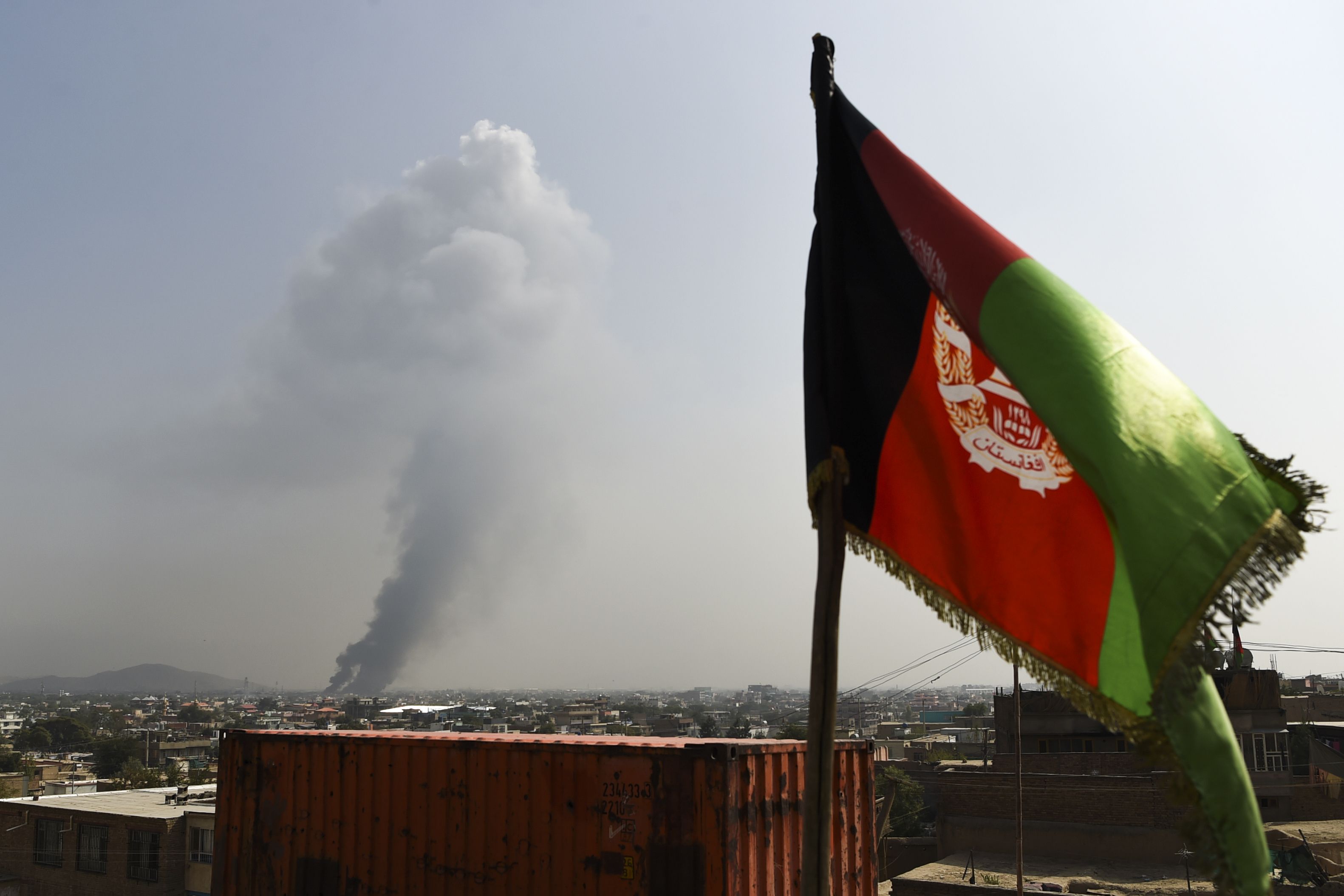 Smoke rises from the site of an attack after a massive explosion the night before near the Green Village in Kabul on September 3