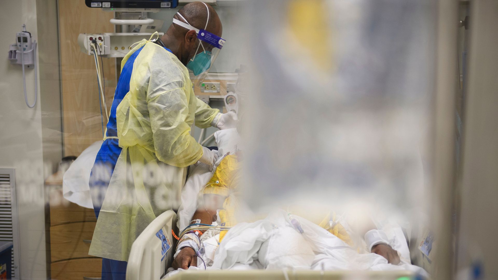 Picture of a health worker taking care of a COVID patient
