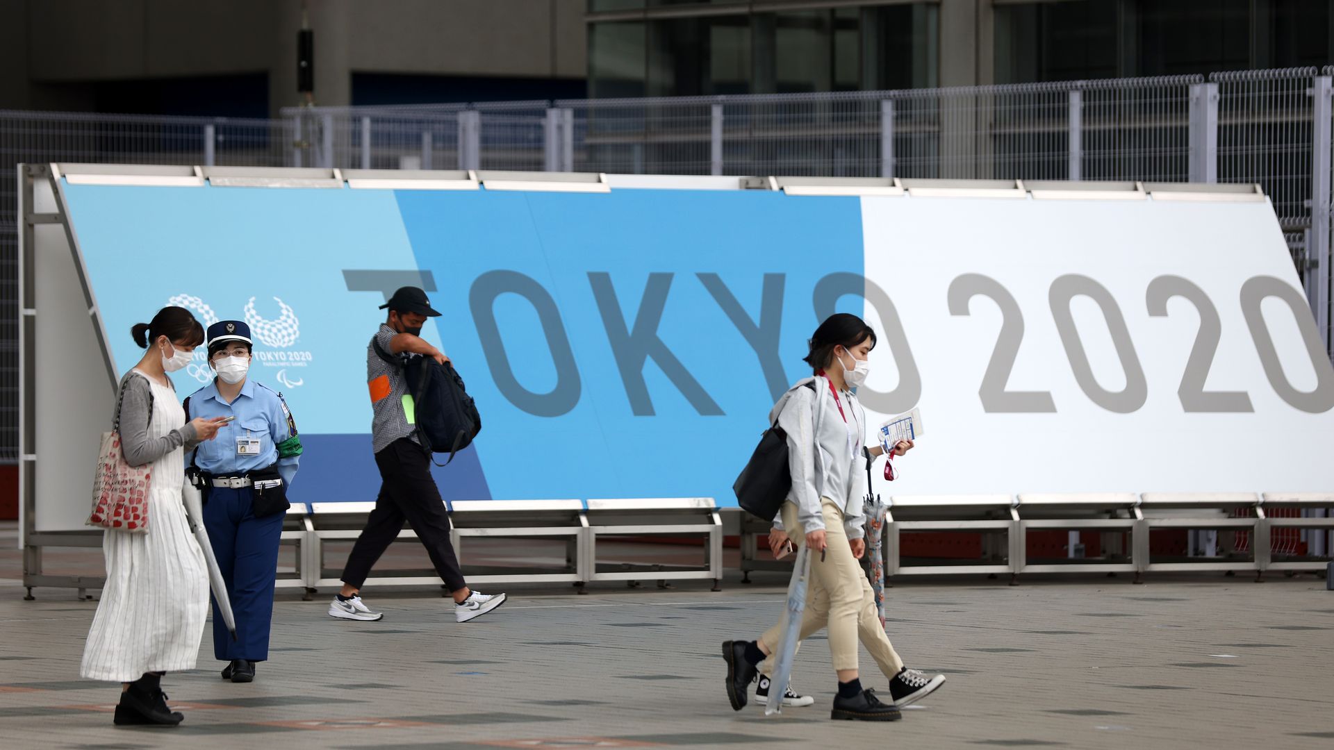 A security guard stands outside the main entrance during the official opening of the Tokyo 2020 Main Press Center ahead of the Tokyo Olympic Games on July 01, 2021.