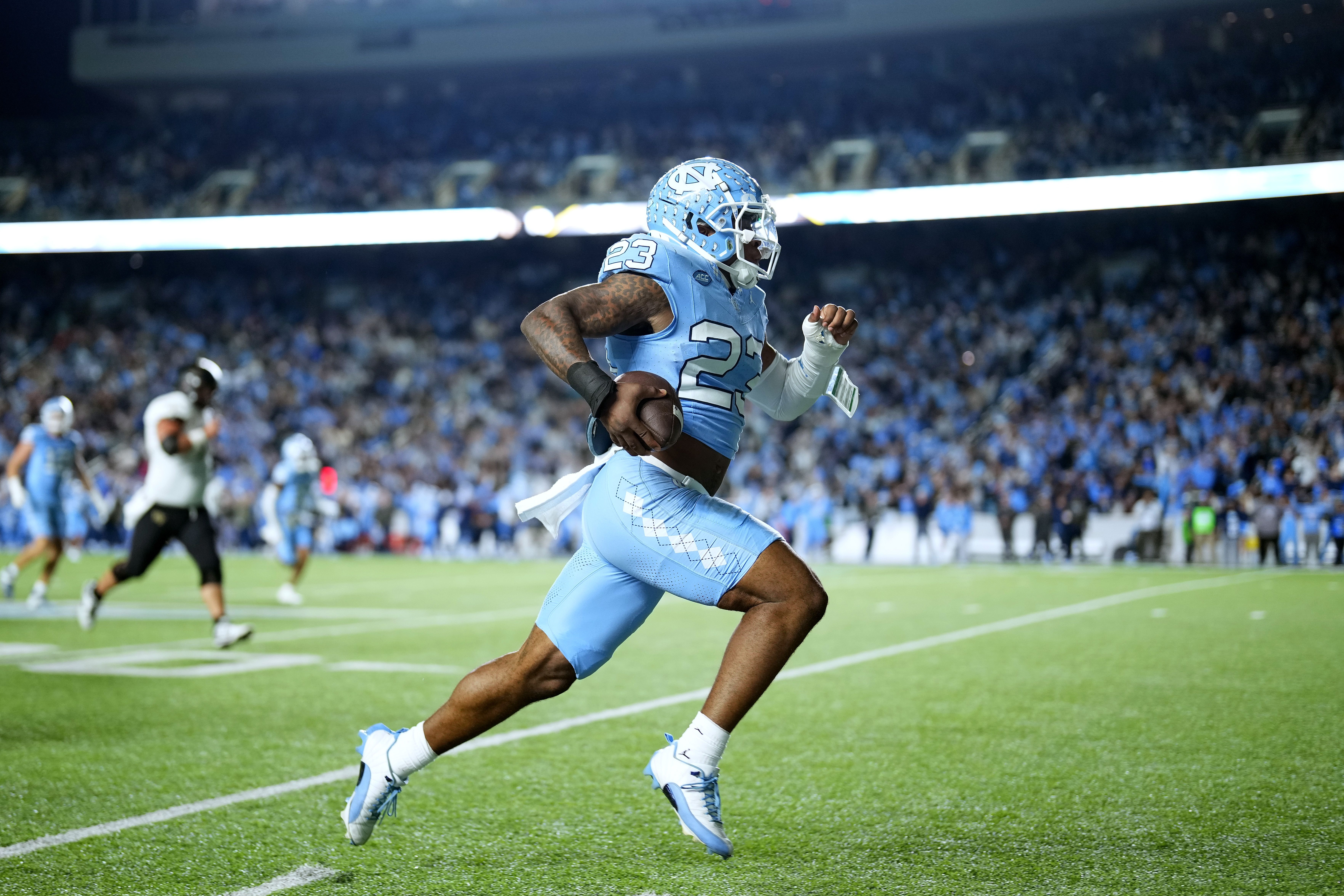 Power Echols #23 of the North Carolina Tar Heels returns an interception for a touchdown against the Wake Forest Demon Deacons during the game at Kenan Memorial Stadium on November 16, 2024 in Chapel Hill, North Carolina. (Photo by Grant Halverson/Getty Images)