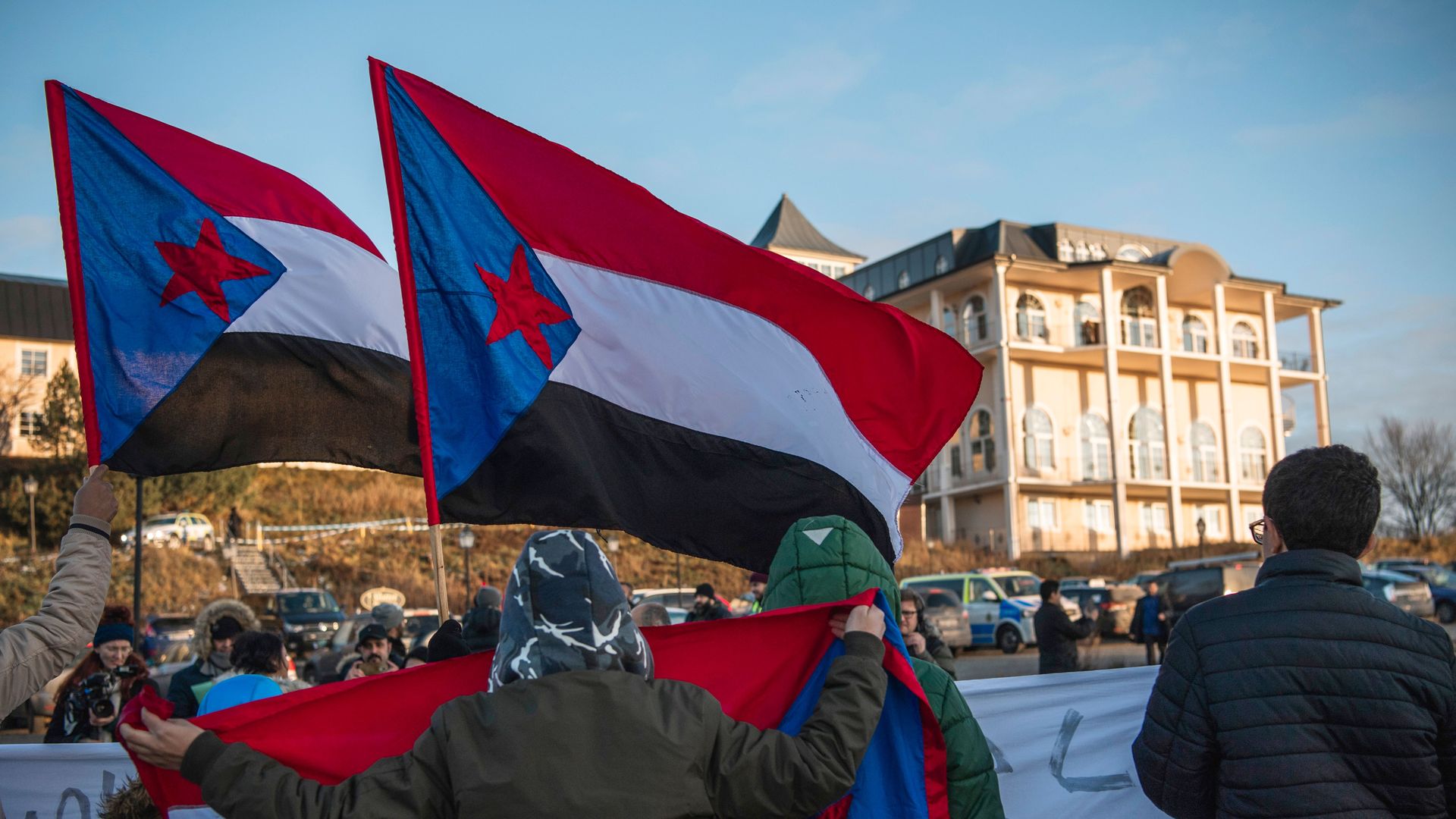 Protestors wave south Yemen flag outside Sweden meeting