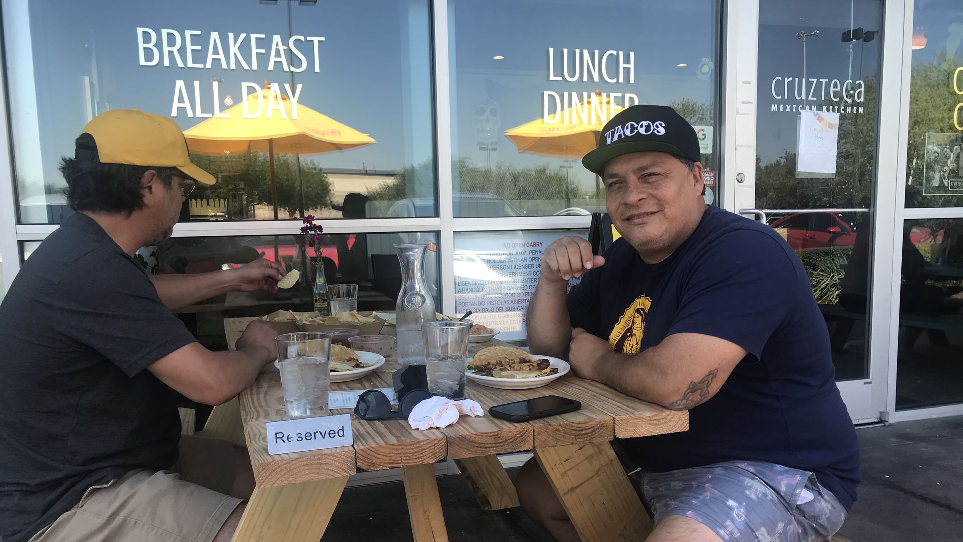 Mando Rayo, right, digs into some grub at Cruzteca