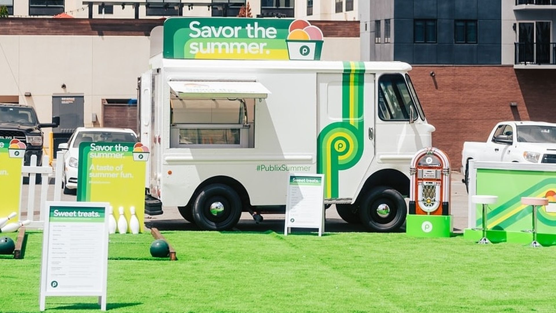 Publix ice cream truck with a sign on top reading "savor the summer"