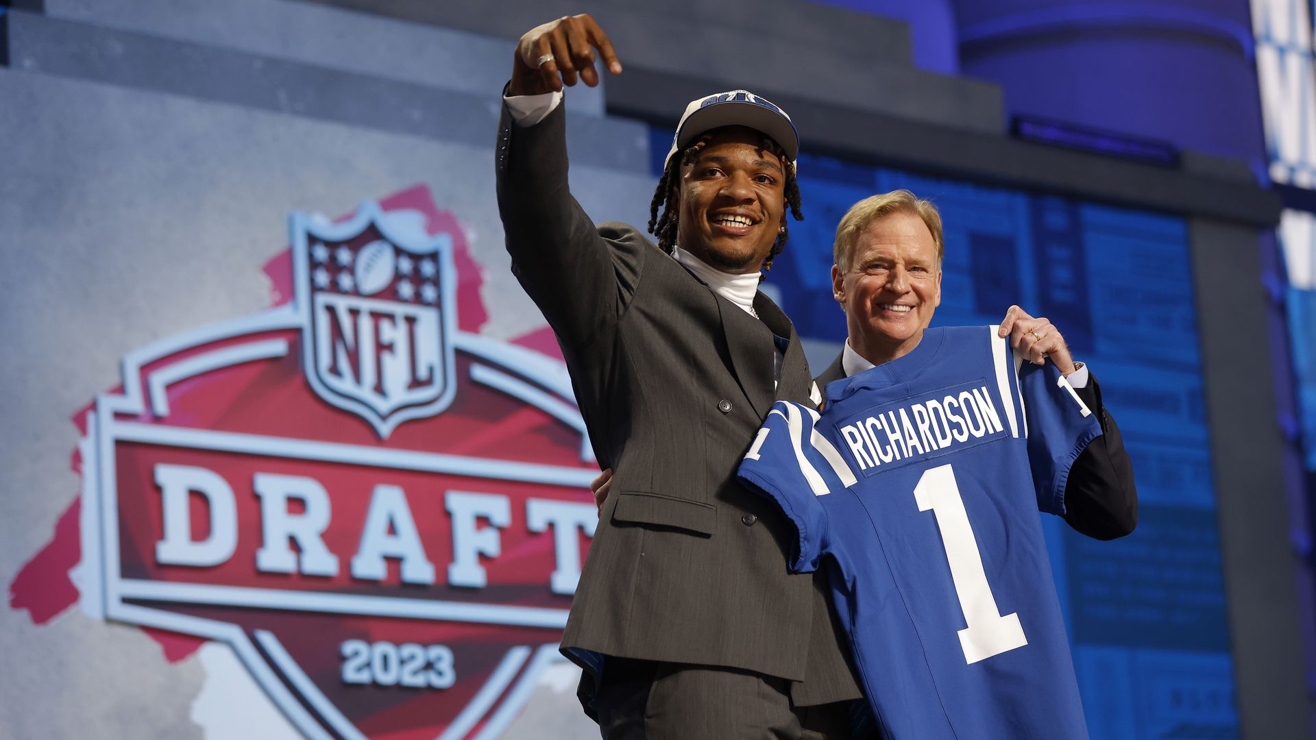 Anthony Richardson poses with NFL Commissioner Roger Goodell, who holds a Richardson Indianapolis Colts jersey, at the NFL Draft.