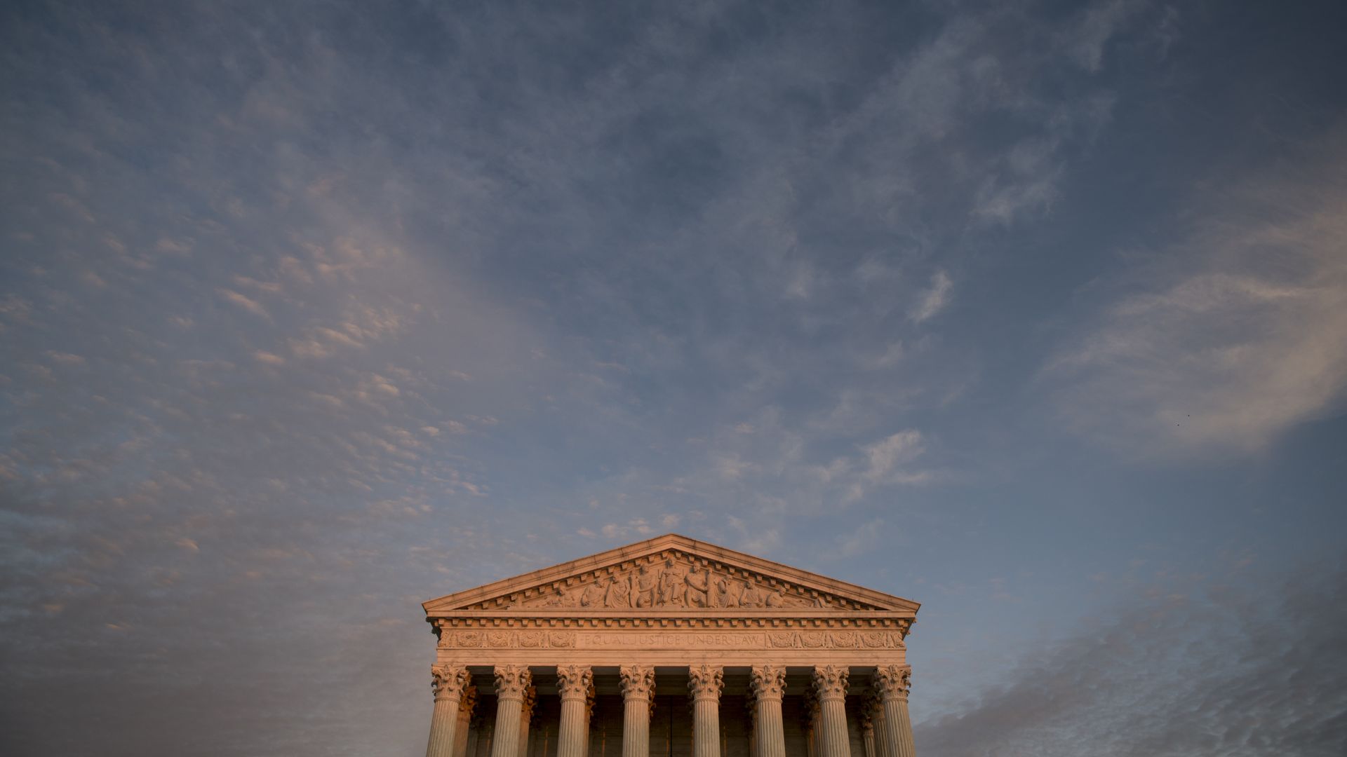A photo of the Supreme Court building at sunset.