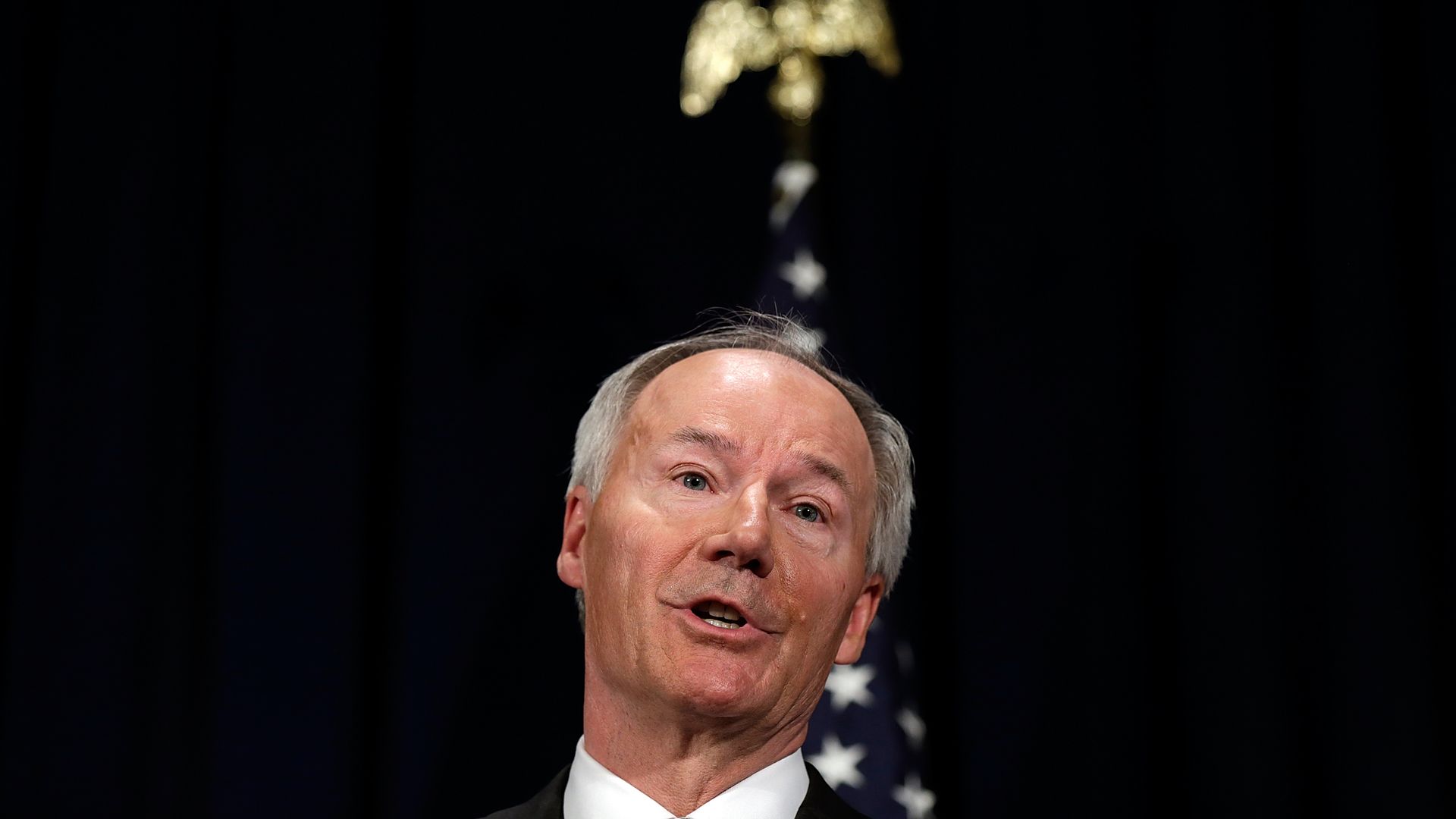 Photo of Asa Hutchinson's head as he talks