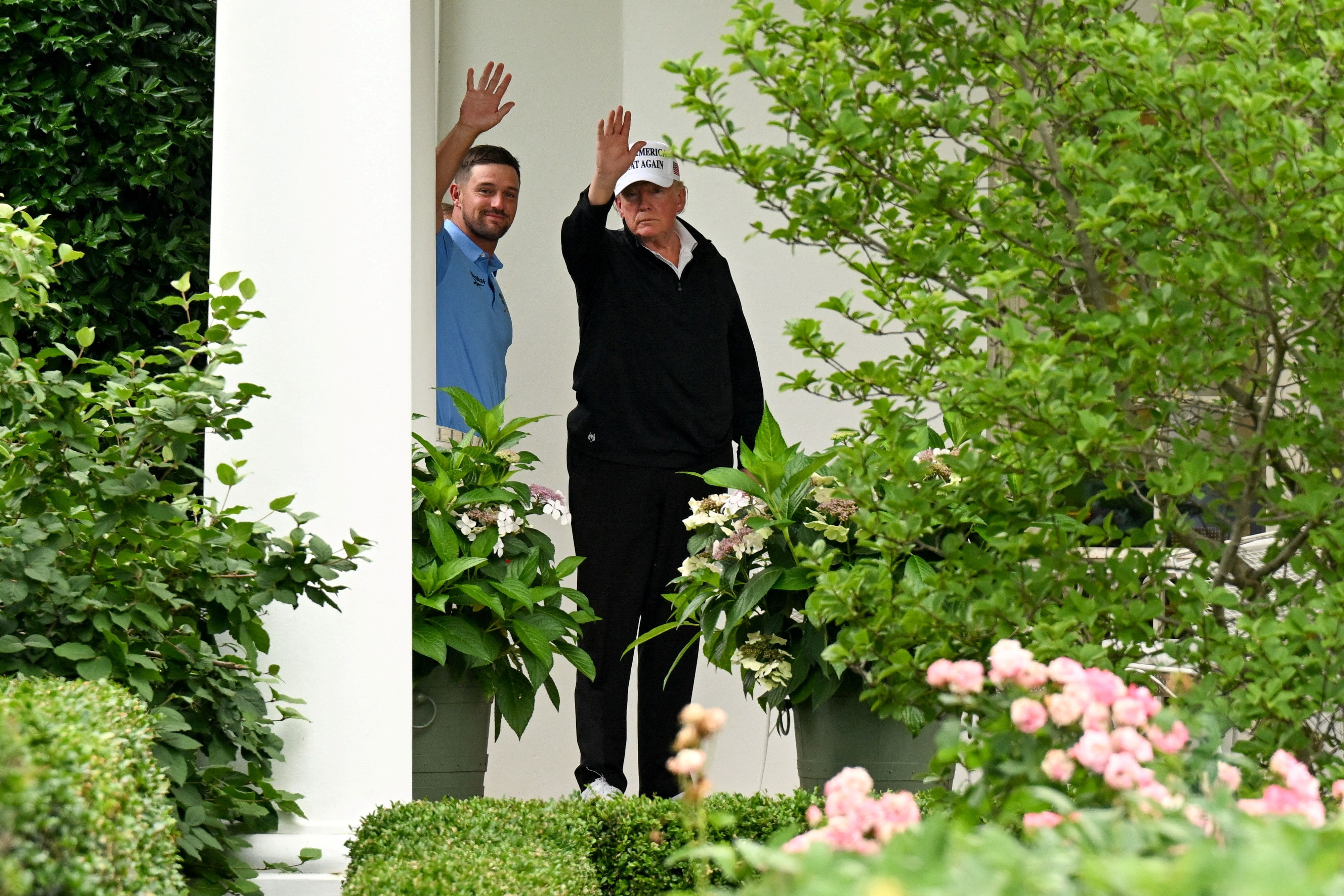 President Trump arrives at the White House from Trump National Golf Club with professional golfer Bryson DeChambeau yesterday.
