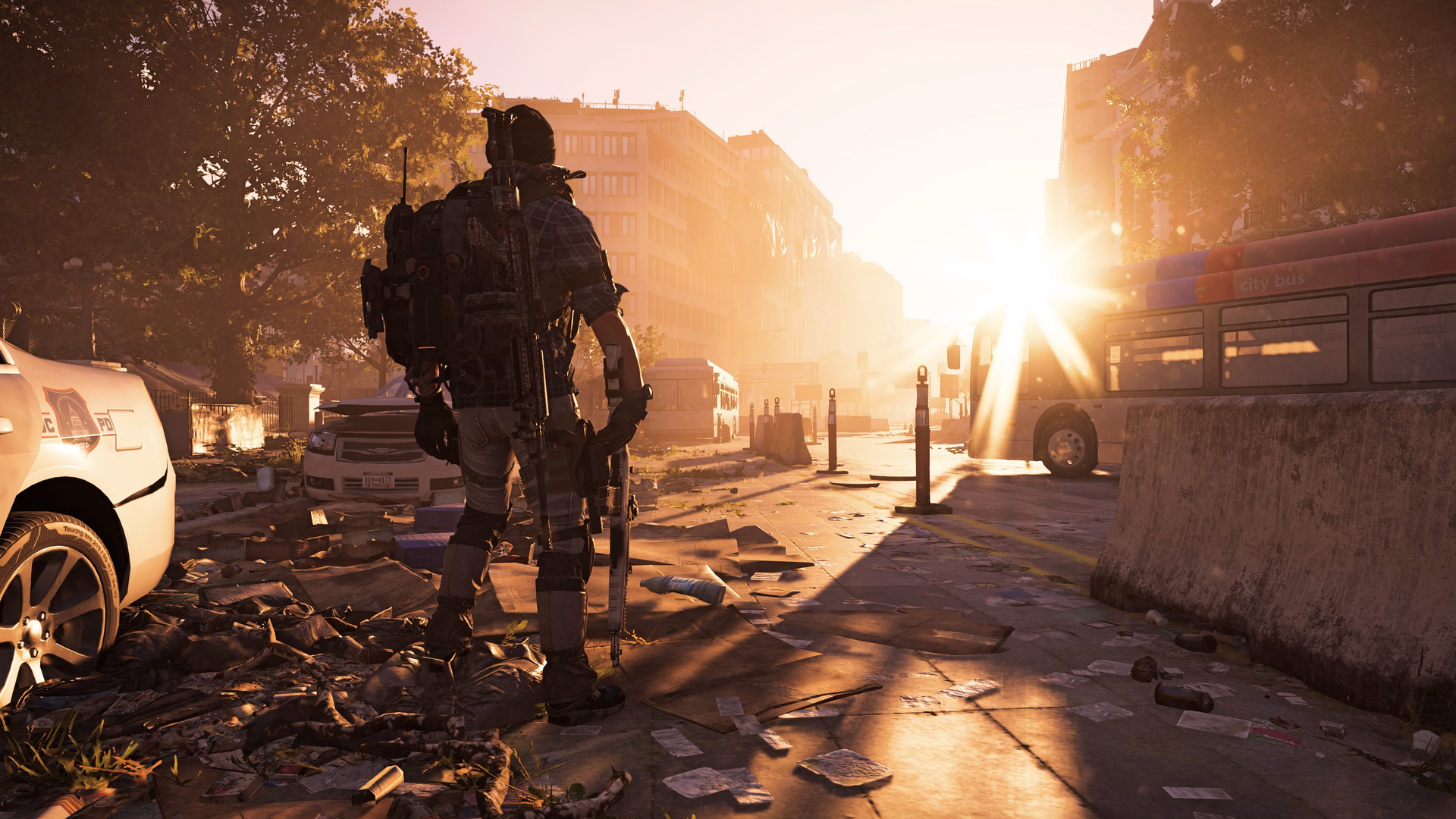 Character in a video game, armed and standing among debris. 